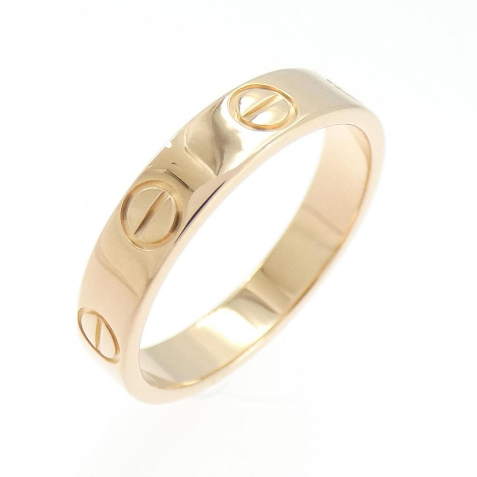 Pink gold ring band by Cartier: Pink gold ring band by Cartier Pink gold ring band by Cartier, featuring a classic design with a few traces of usage visible. The item bears some scratches and dirt but remains in very good condition