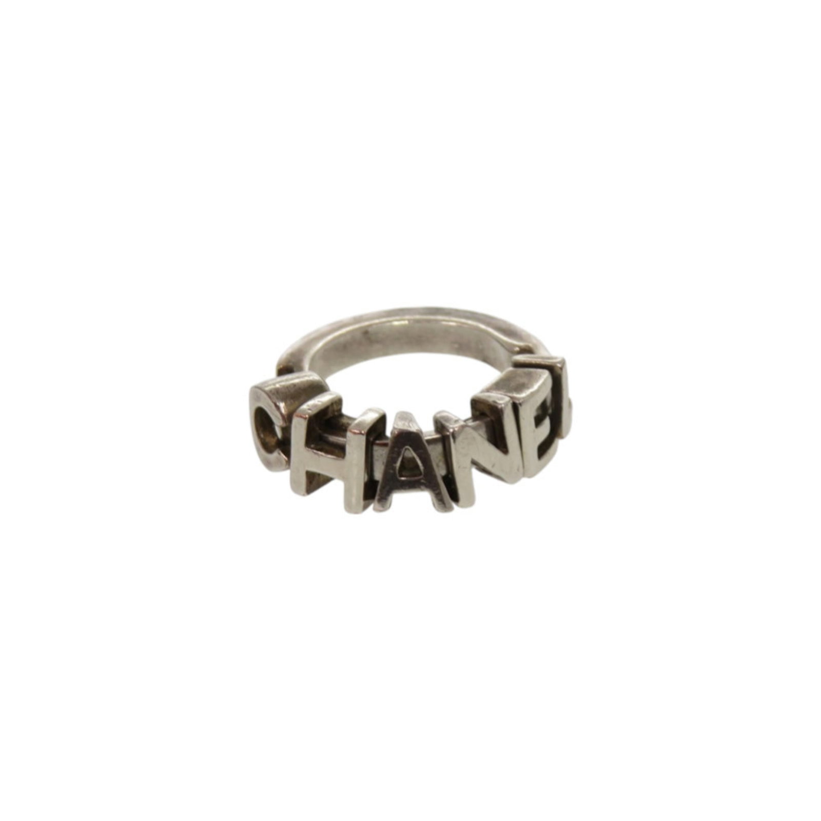 Ring from Chanel: Ring from Chanel Silver band ring from Chanel, featuring a 7mm width and inner diameter of 57.00mm, available in size 5.5. This used ring shows traces of usage with minor damages and dirt, but