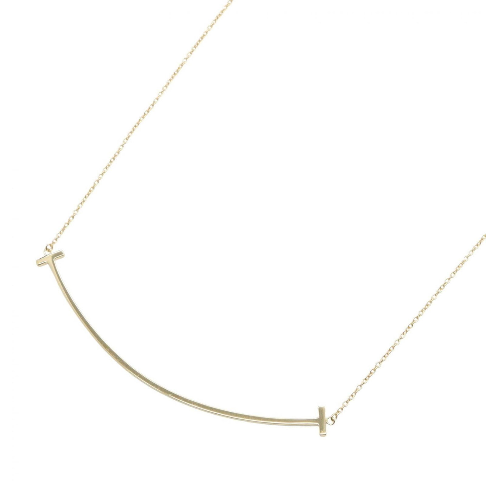 Smile Large Tiffany Gold Necklace 18K Yellow Women's Tone Jewelry: Smile Large Tiffany Gold Necklace 18K Yellow Women's Tone Jewelry 18K Yellow Gold Tiffany Necklace in Excellent Condition. This beautiful necklace features a 5mm x 67mm pendant set in yellow gold,