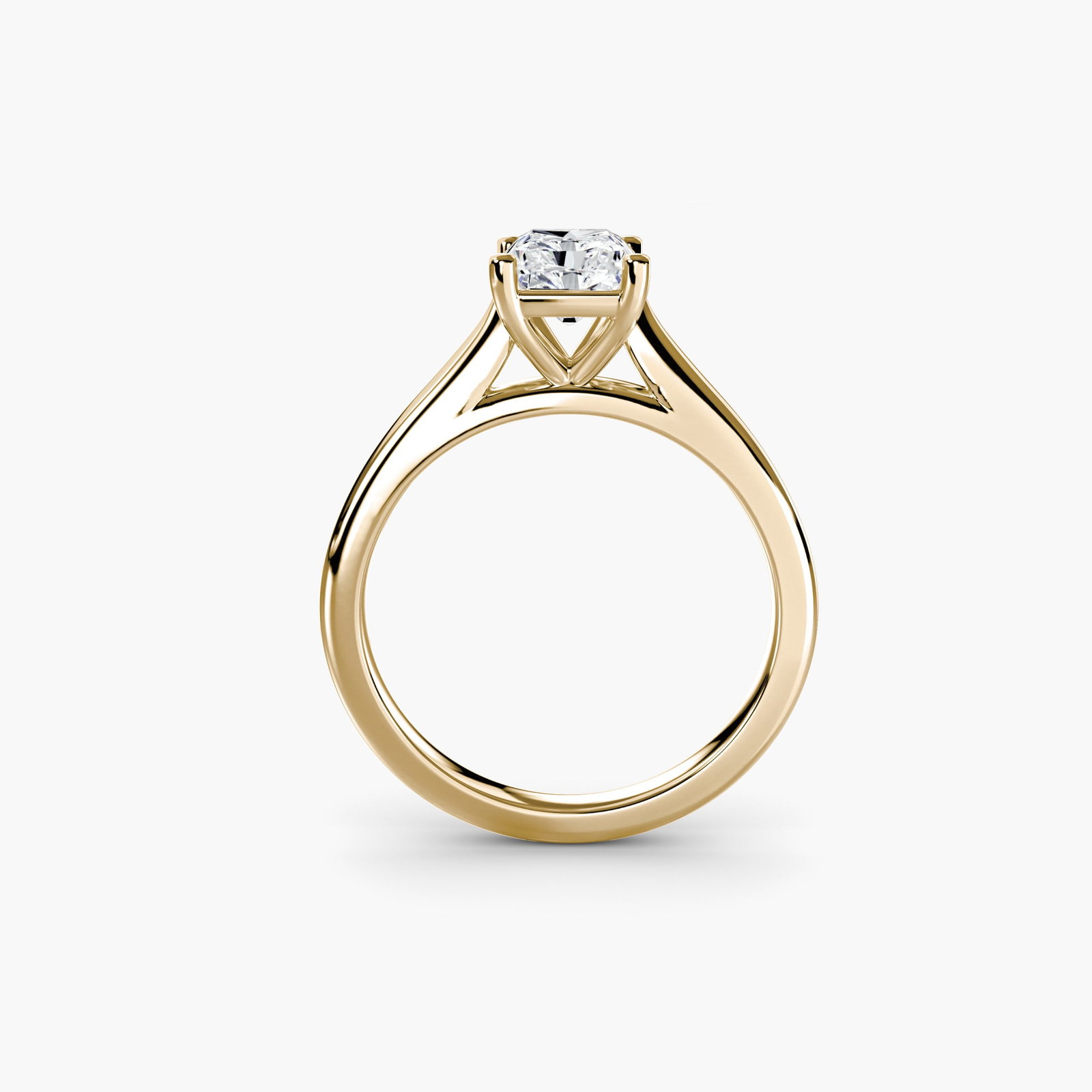 Solitaire Radiant 14Kt Yellow Gold Ring Setting: Solitaire Radiant 14Kt Yellow Gold Ring Setting Radiant solitaire setting in 14Kt yellow gold, featuring a slender band with a width of 2. This elegant ring showcases the beauty of its metalwork,