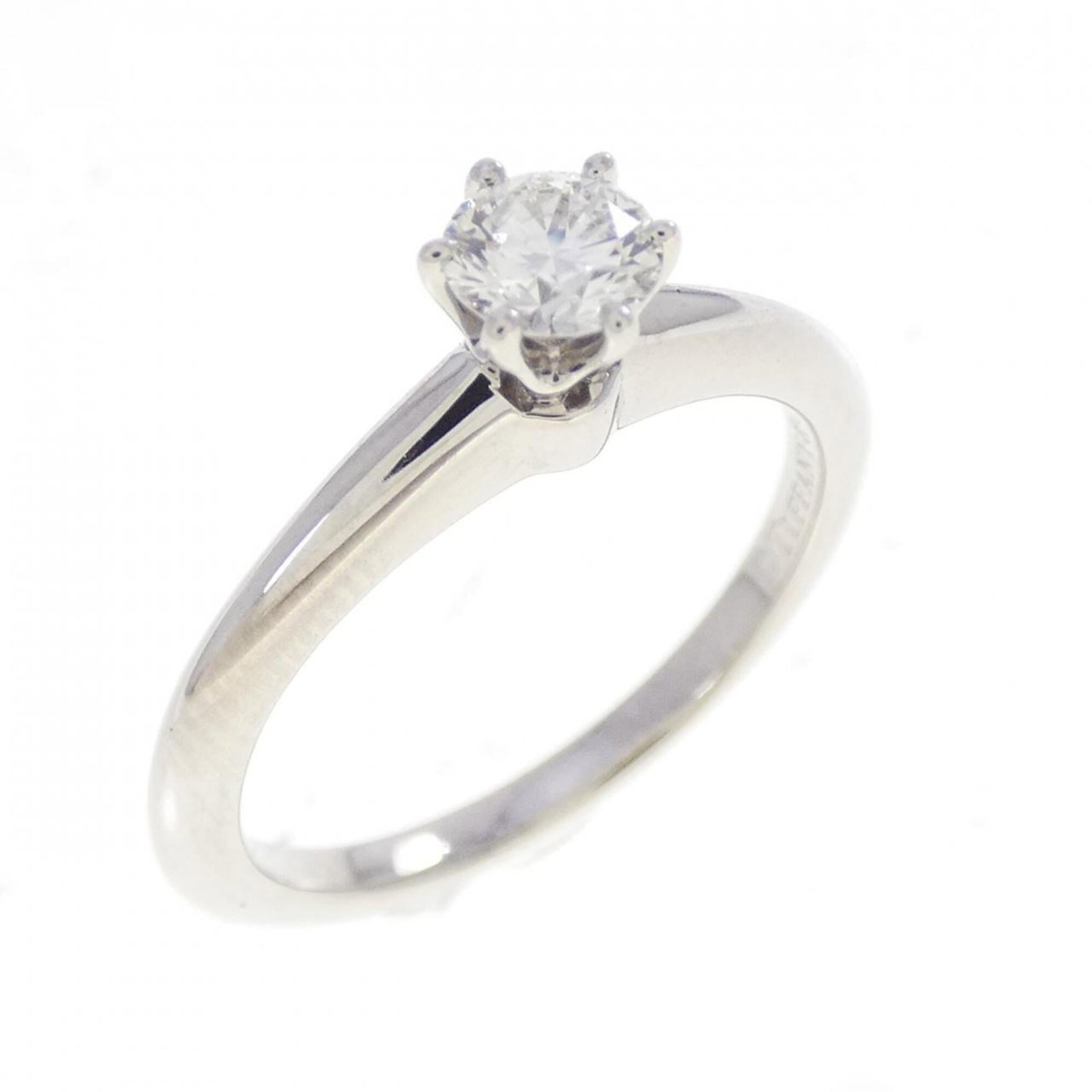 Platinum ring by Tiffany band: Platinum ring by Tiffany band Platinum ring by Tiffany features a diamond stone weighing 0.26 carats, set in a platinum band with a US size 5 fit. The item is made from high-quality platinum material 