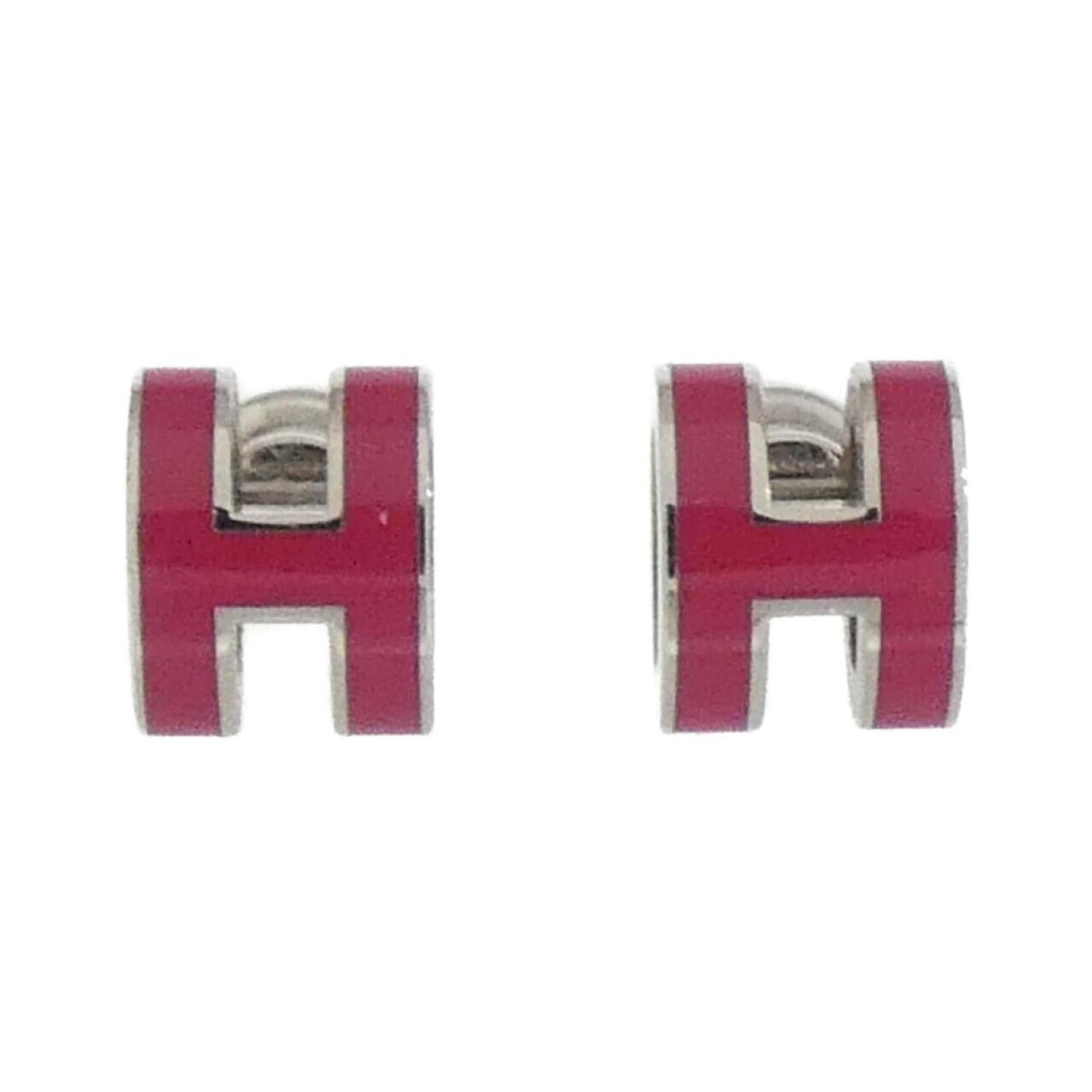 Hermes Stud Earrings: Hermes Stud Earrings Stud earrings from the renowned luxury brand Hermes, featuring a delicate pink hue and sleek silver finish. The earrings showcase a classic stud design with subtle wear, bearing m