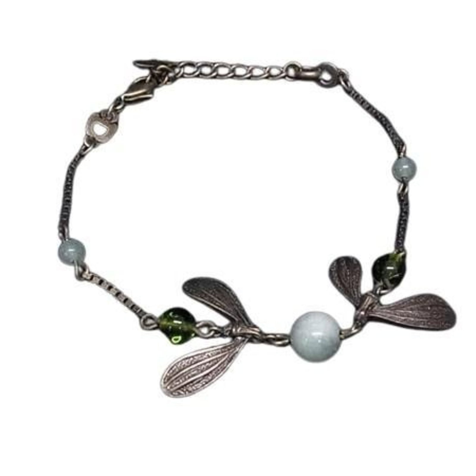 Metal Charm Christian Dior: Metal Charm Christian Dior Bronze and green metal charm from Christian Dior's iconic collection, bearing subtle signs of wear. The charm measures 21.2cm in length, with a few minor scratches and dirt