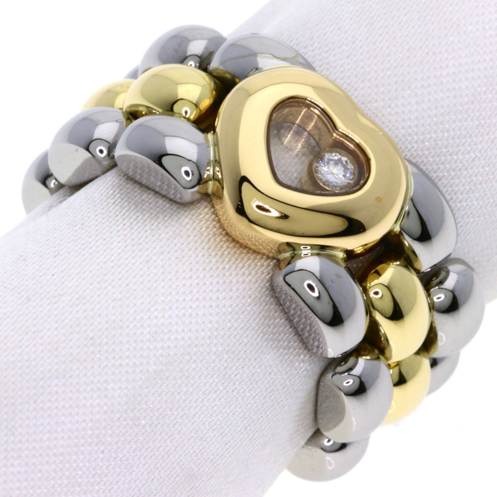 Chopard Band Ring Stainless Steel Yellow Gold (18K): Chopard Band Ring Stainless Steel Yellow Gold (18K) Stainless steel and yellow gold (18K) come together in this elegant band ring from Chopard. A few traces of usage are visible, with some scratches a