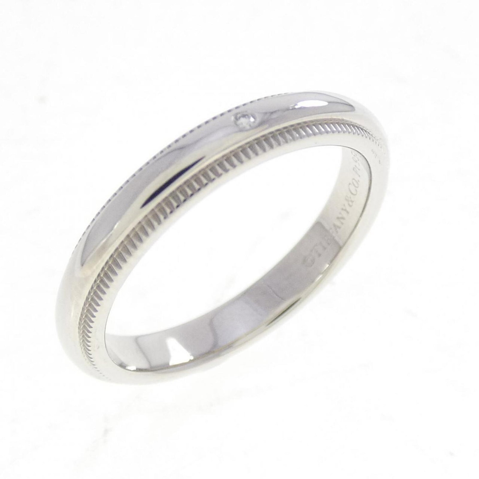 Platinum ring by Tiffany band: Platinum ring by Tiffany band Platinum ring by Tiffany features a diamond stone set in a band style design, crafted from high-quality platinum material. The item is a used (like new) condition, with h