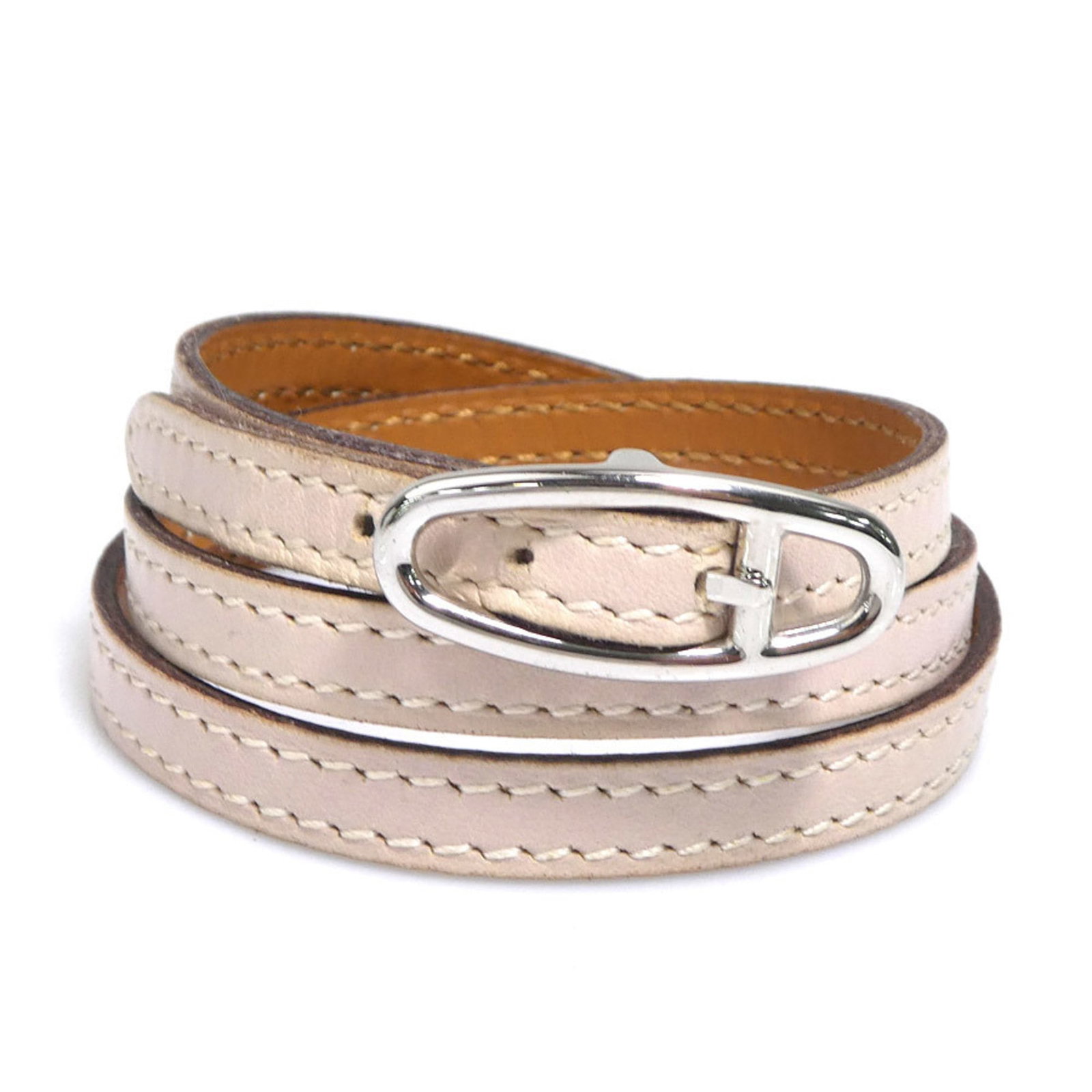 Metal Leather Charm Hermes Bracelet: Metal Leather Charm Hermes Bracelet Baby pink leather and silver metal come together in this unique charm bracelet from Hermes, featuring subtle traces of usage and minor scratches. The total length