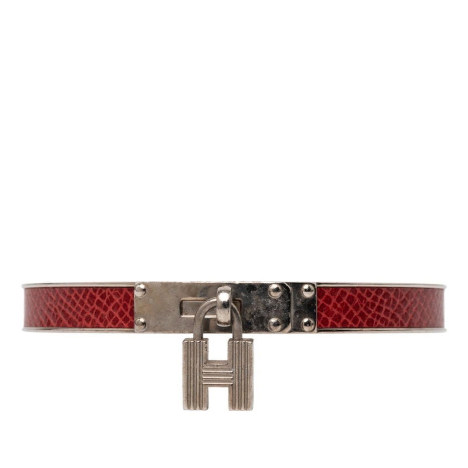 Metal leather bangle Hermes: Metal leather bangle Hermes This used Hermes metal leather bangle features a striking red color and silver accents, measuring 19cm in length. The bangle bears signs of usage, with visible scratches
