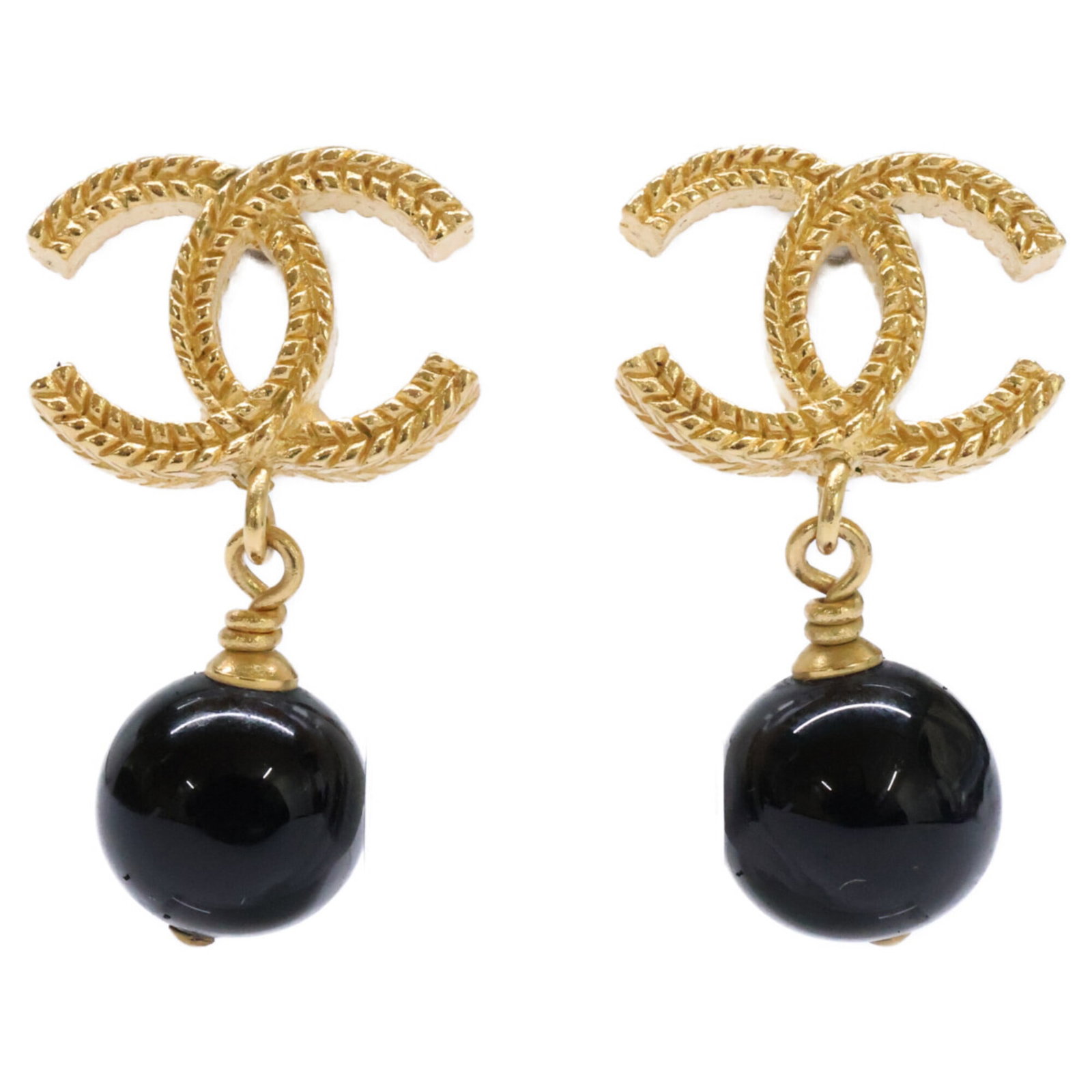 Stud Earrings Metal by Chanel: Stud Earrings Metal by Chanel Gold stud earrings by Chanel, featuring metal construction and a classic design. The item shows some signs of usage, including minor scratches and dirt, but remains in ve