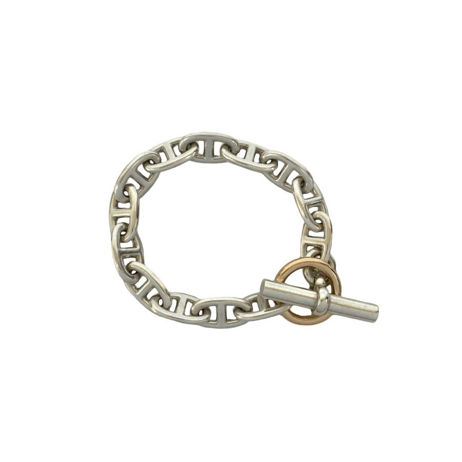 Charm bracelet pink gold silver 925 by Hermes: Charm bracelet pink gold silver 925 by Hermes Pink gold and silver 925 charm bracelet from iconic luxury brand Hermes, featuring a delicate design with subtle wear. The 21.5cm length offers a versatil