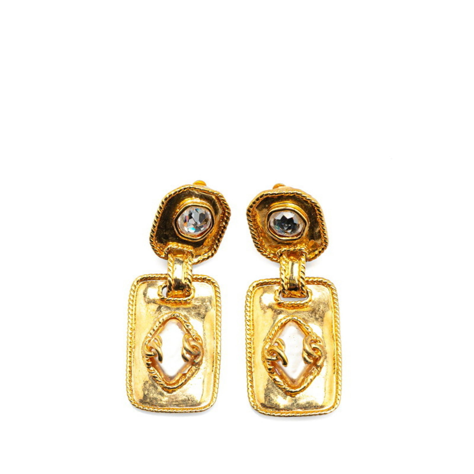 Chanel Clip Earrings: Chanel Clip Earrings Gold clip earrings from the iconic Chanel brand, bearing subtle traces of usage and minor scratches. Measuring 56mm x 22.50mm, these vintage earrings showcase a classic design tha