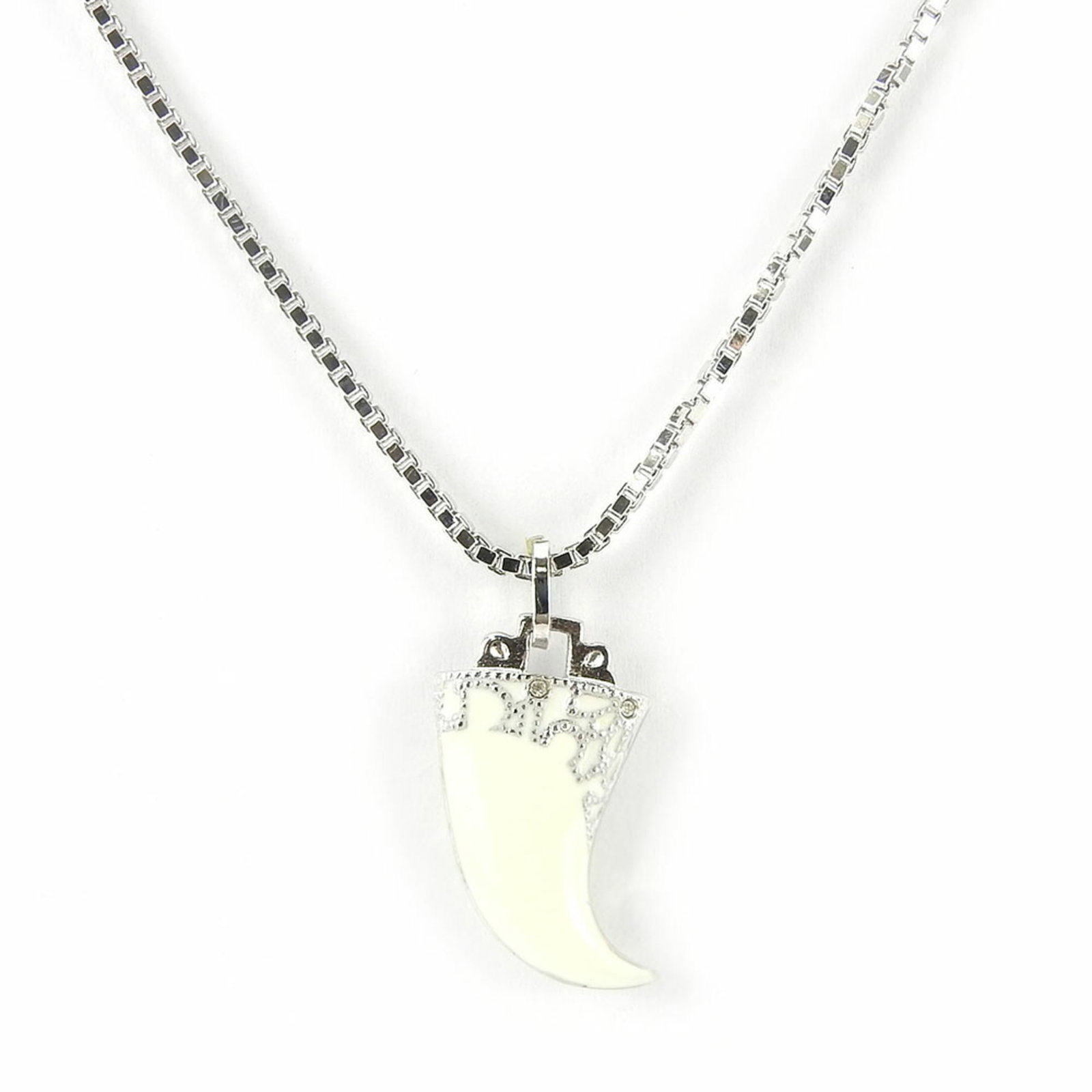 Christian Dior necklace metal silver white fang motif plated women's: Christian Dior necklace metal silver white fang motif plated women's The Christian Dior necklace boasts a striking silver and white fang motif, adding an edgy touch to any outfit. Made from plated