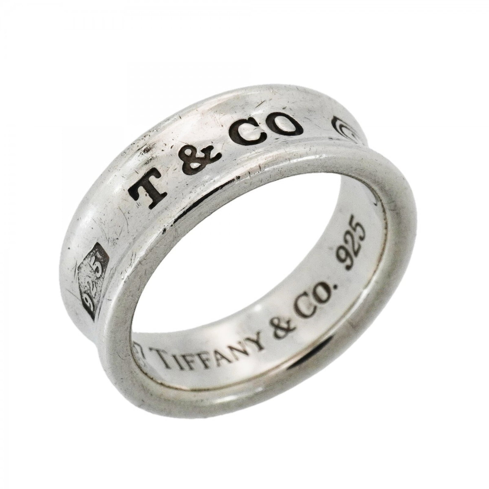 Tiffany Band Ring Silver 925: Tiffany Band Ring Silver 925 Silver 925 Tiffany Band Ring, Us Size 6.5, in good condition with traces of usage and minor scratches. This band ring features a silver 925 material and bears the Tiffany 