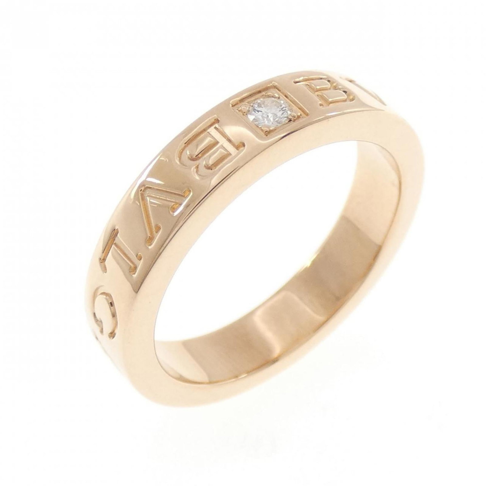 Pink Gold 18K Bvlgari Band Ring: Pink Gold 18K Bvlgari Band Ring Pink Gold 18K Bvlgari Band Ring features a stunning pink gold setting, adorned with a diamond stone. The ring's elegant design showcases the luxury brand's signature st