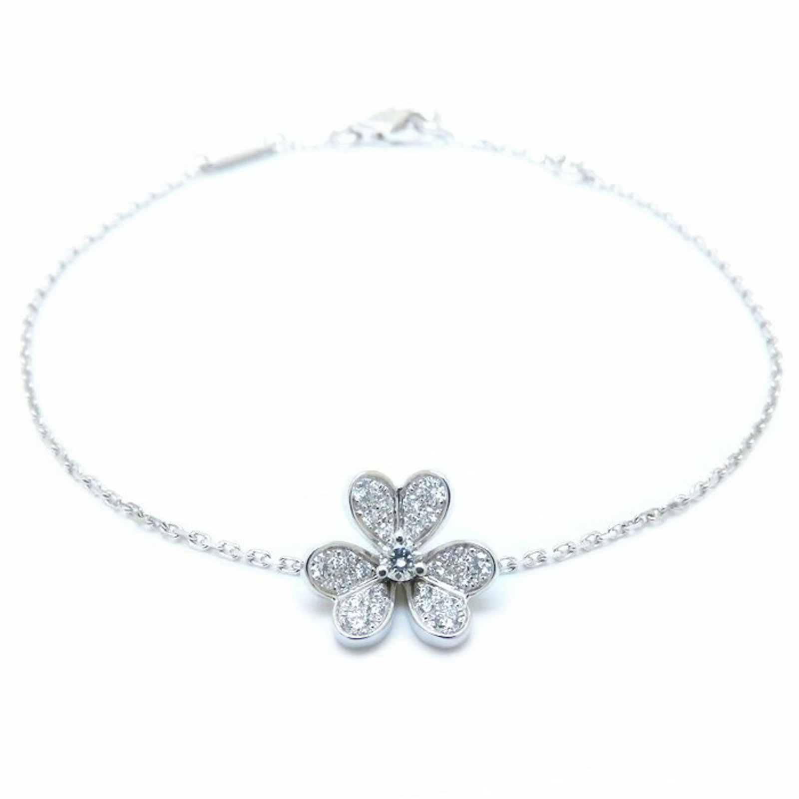 Van Cleef & Arpels Charm Bracelet White Gold (18K): Van Cleef & Arpels Charm Bracelet White Gold (18K) This Van Cleef & Arpels charm bracelet features a beautiful white gold setting and a touch of elegance with its diamond accents. Measuring approximat