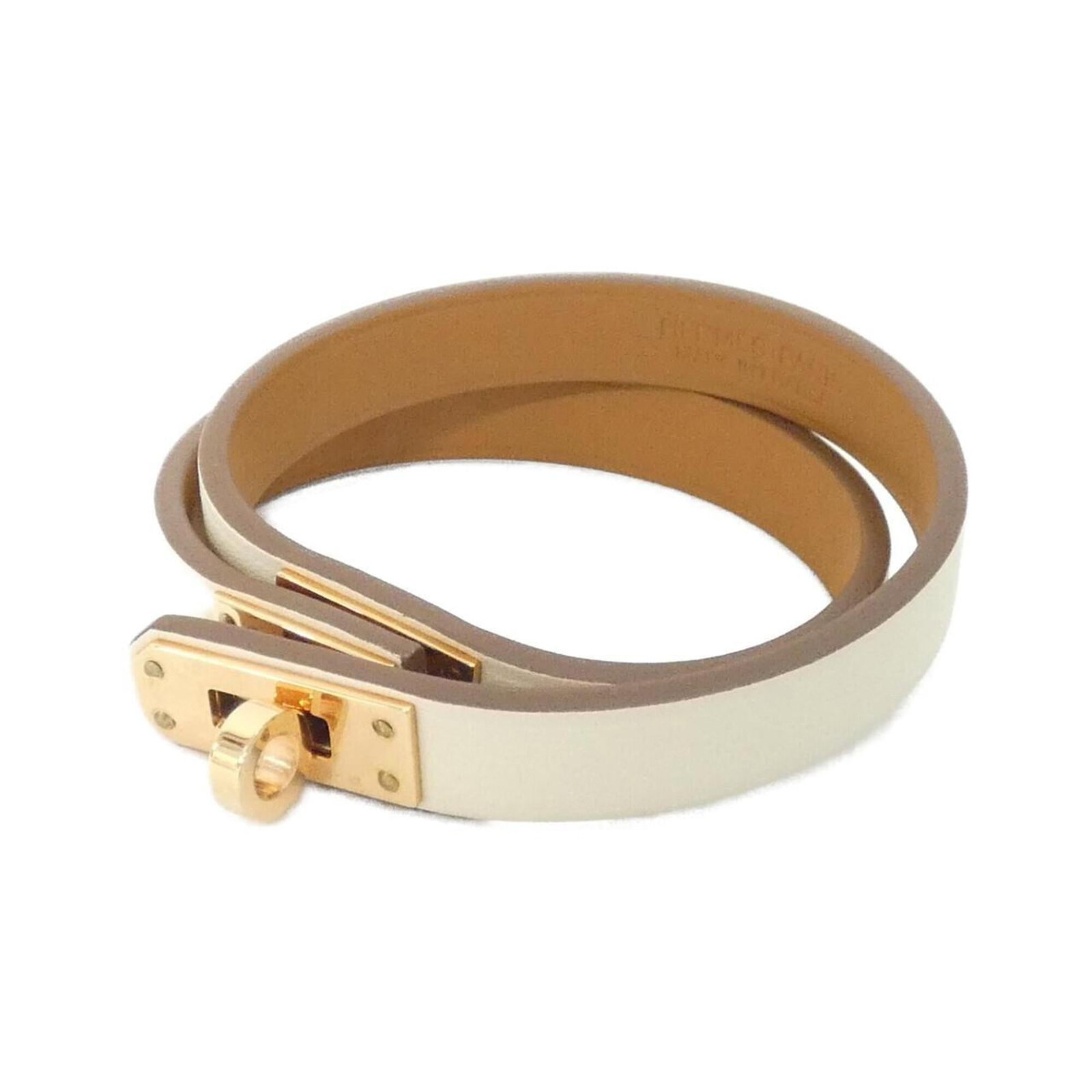 Hermes Leather Charm Swift Bracelet: Hermes Leather Charm Swift Bracelet Swift Leather Charm Bracelet in Beige and White, featuring a classic design with a subtle elegance. Made from high-quality Swift Leather, this charm bracelet boasts