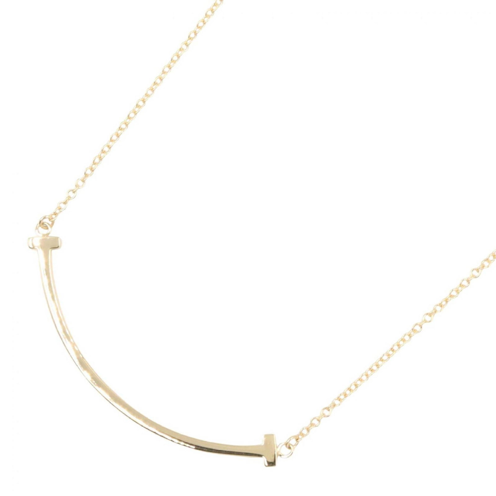Tiffany & Co. T Smile Small Necklace 18K (Yellow Gold) Women'S Jewelry Gold Tone: Tiffany & Co. T Smile Small Necklace 18K (Yellow Gold) Women'S Jewelry Gold Tone 18K yellow gold necklace with a small, elegant pendant. This T Smile Small Necklace features a 3mm x 37mm pendant in a