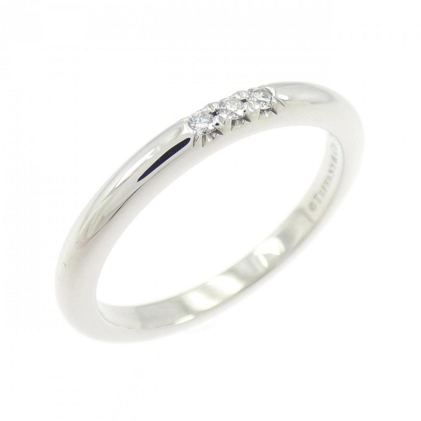 Platinum ring by Tiffany band: Platinum ring by Tiffany band Platinum ring by Tiffany features a silver band with a subtle shine, crafted from high-quality platinum material. The ring bears the signature of its creator and has been