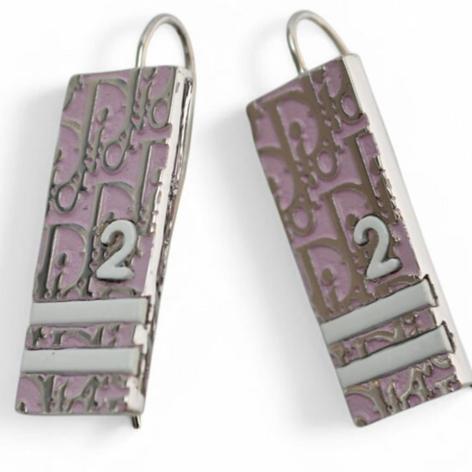 Dior Christian Metal Drop Earrings: Dior Christian Metal Drop Earrings Light Pink and Silver Dior Drop Earrings. These casual drop earrings feature a light pink metal with silver accents, adding a touch of elegance to any outfit. With