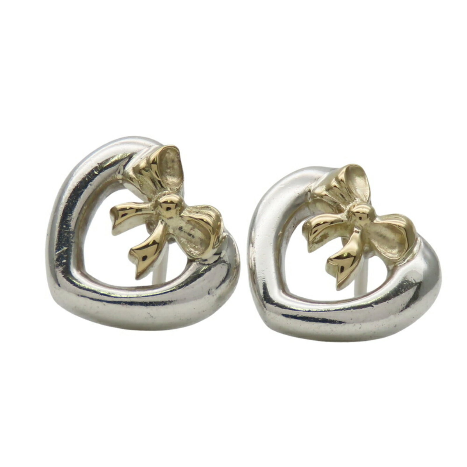 Tiffany Stud Earrings Silver 925 Yellow Gold (18K): Tiffany Stud Earrings Silver 925 Yellow Gold (18K) Tiffany's iconic stud earrings feature a sleek silver and yellow gold (18K) design, adding a touch of sophistication to any outfit. With their