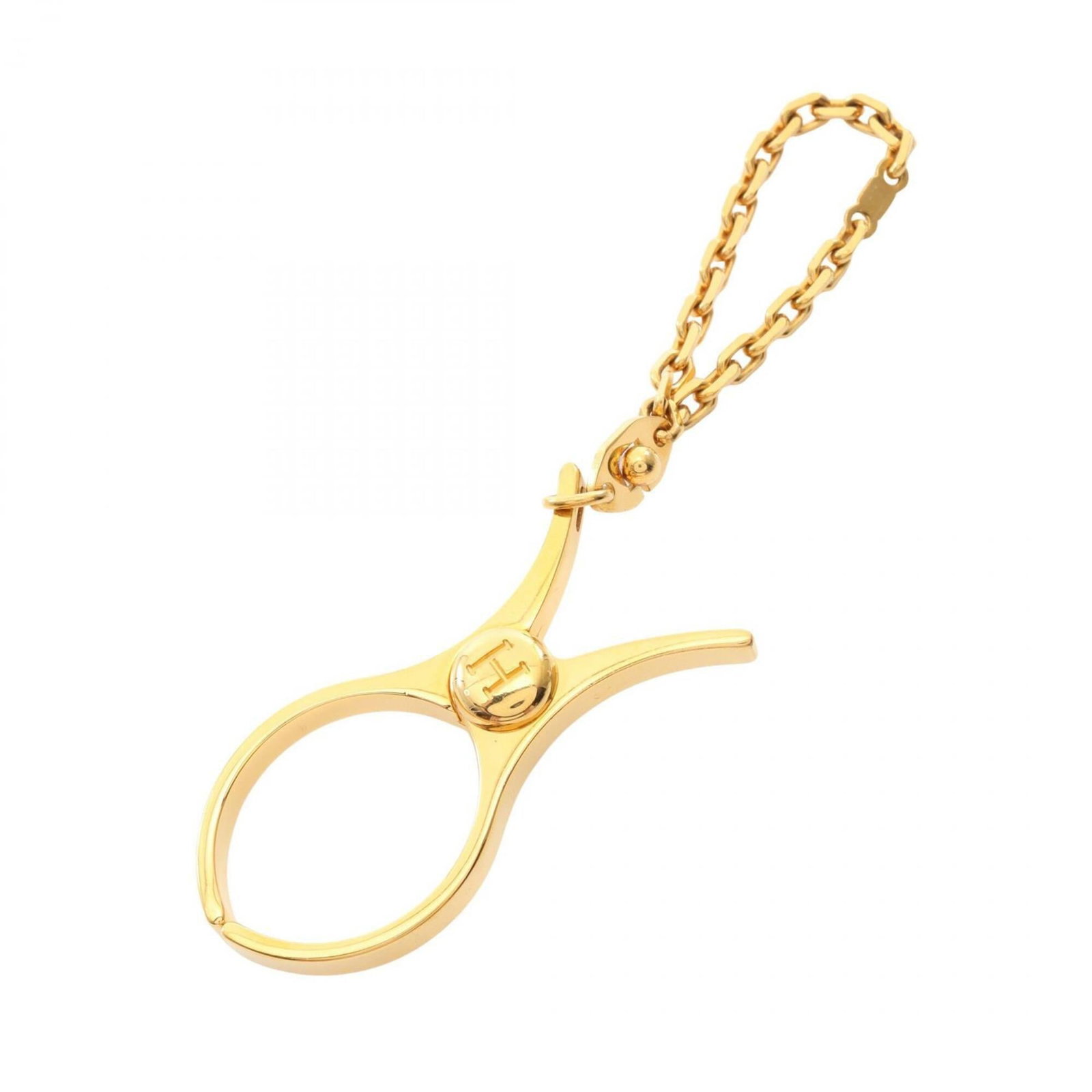 Hermes Handbag Charm Gold: Hermes Handbag Charm Gold Gold-plated charm from the iconic Hermes brand, bearing subtle traces of usage and minor damages. This charming accessory still shines with its elegant gold finish, making
