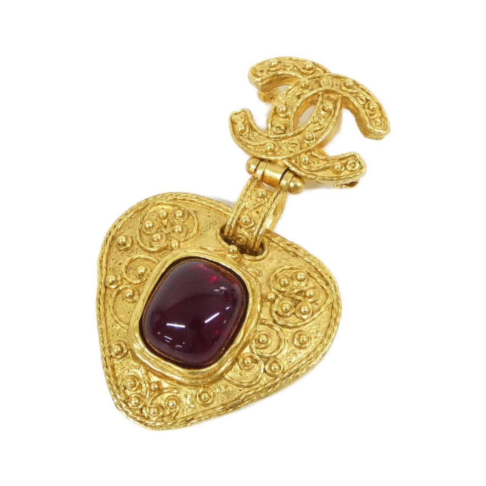 Chanel Brooch: Chanel Brooch This gold and red Chanel brooch showcases the iconic brand's signature style. Measuring 6cm x 3.5cm, it features a few subtle traces of usage, including minor scratches and dirt, but rem