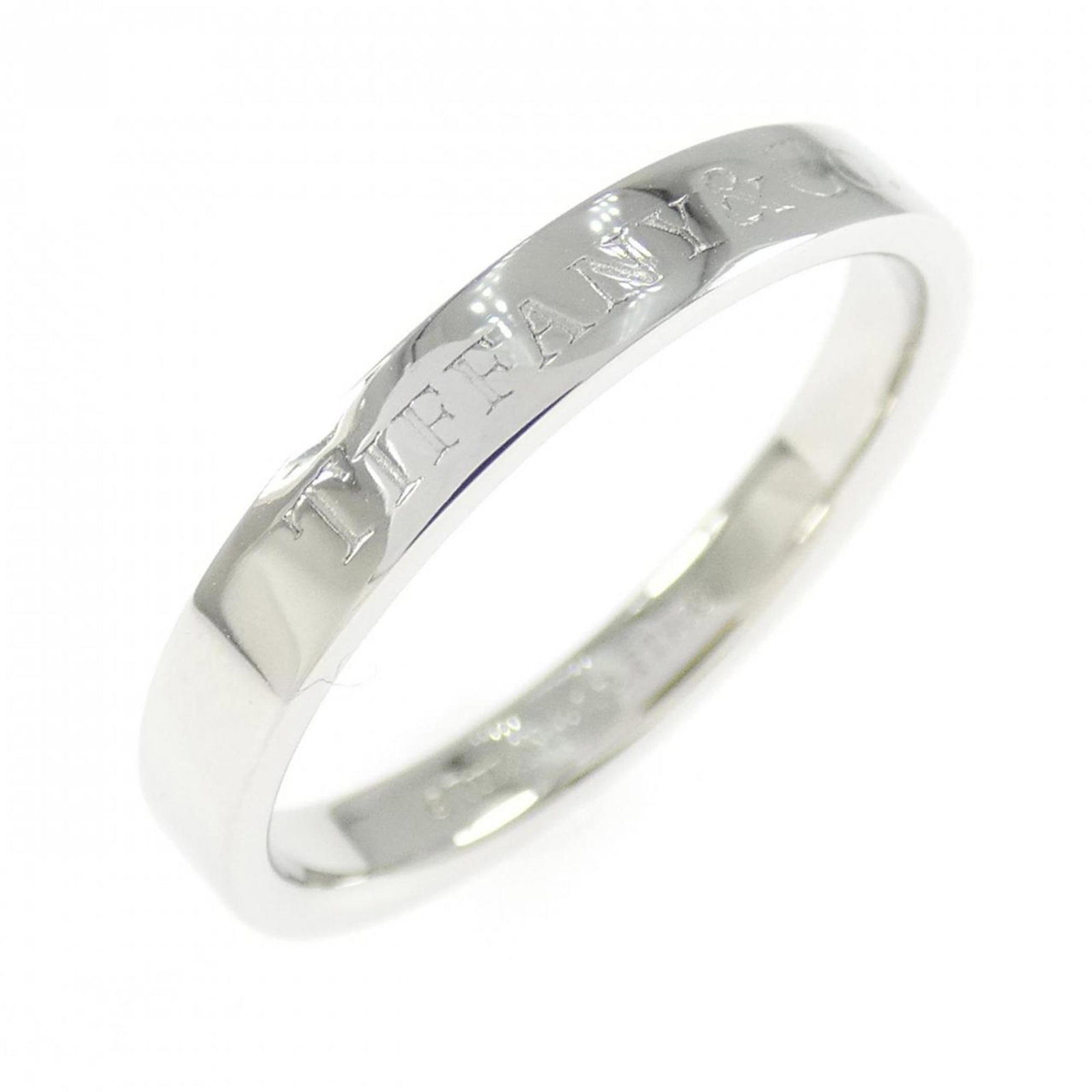 Platinum ring by Tiffany band: Platinum ring by Tiffany band Platinum ring by Tiffany features a classic band design, crafted from high-quality platinum. With its elegant simplicity and understated sophistication, this timeless pie