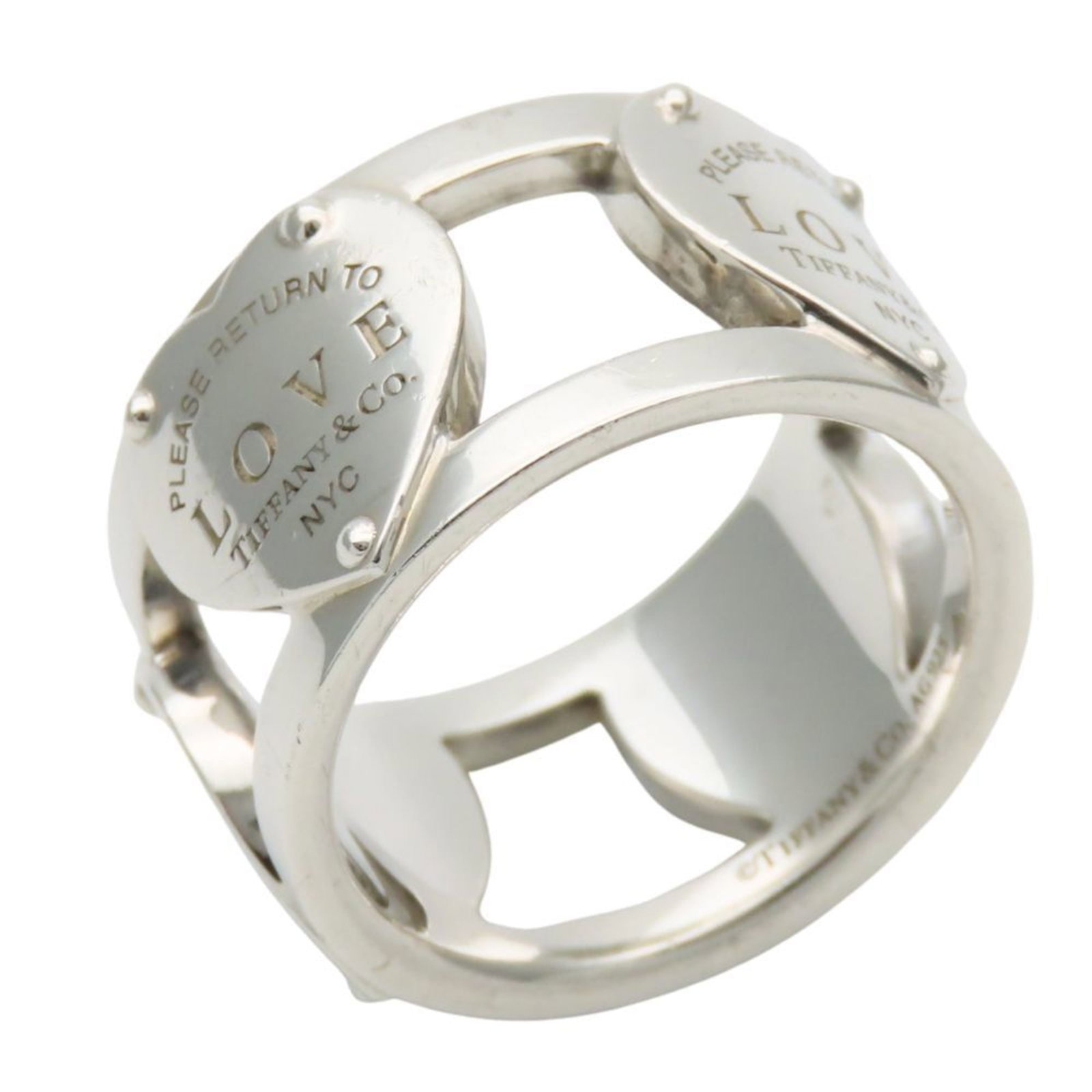 Tiffany Band Ring Silver 925: Tiffany Band Ring Silver 925 Silver 925 band ring from Tiffany, featuring a classic design with subtle wear and minor scratches. The item bears a signature but its origin is unknown. In good