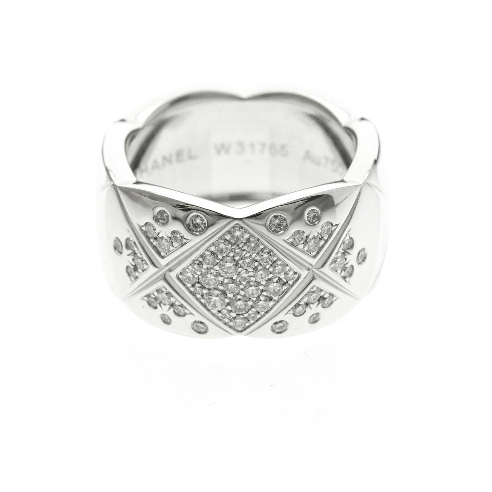 Chanel White Gold Ring Band 18K: Chanel White Gold Ring Band 18K 18K White Gold Ring Band from Chanel, featuring a sleek and sophisticated design. This used band boasts a silver finish and measures 11.2mm in width, weighing 16.1g.