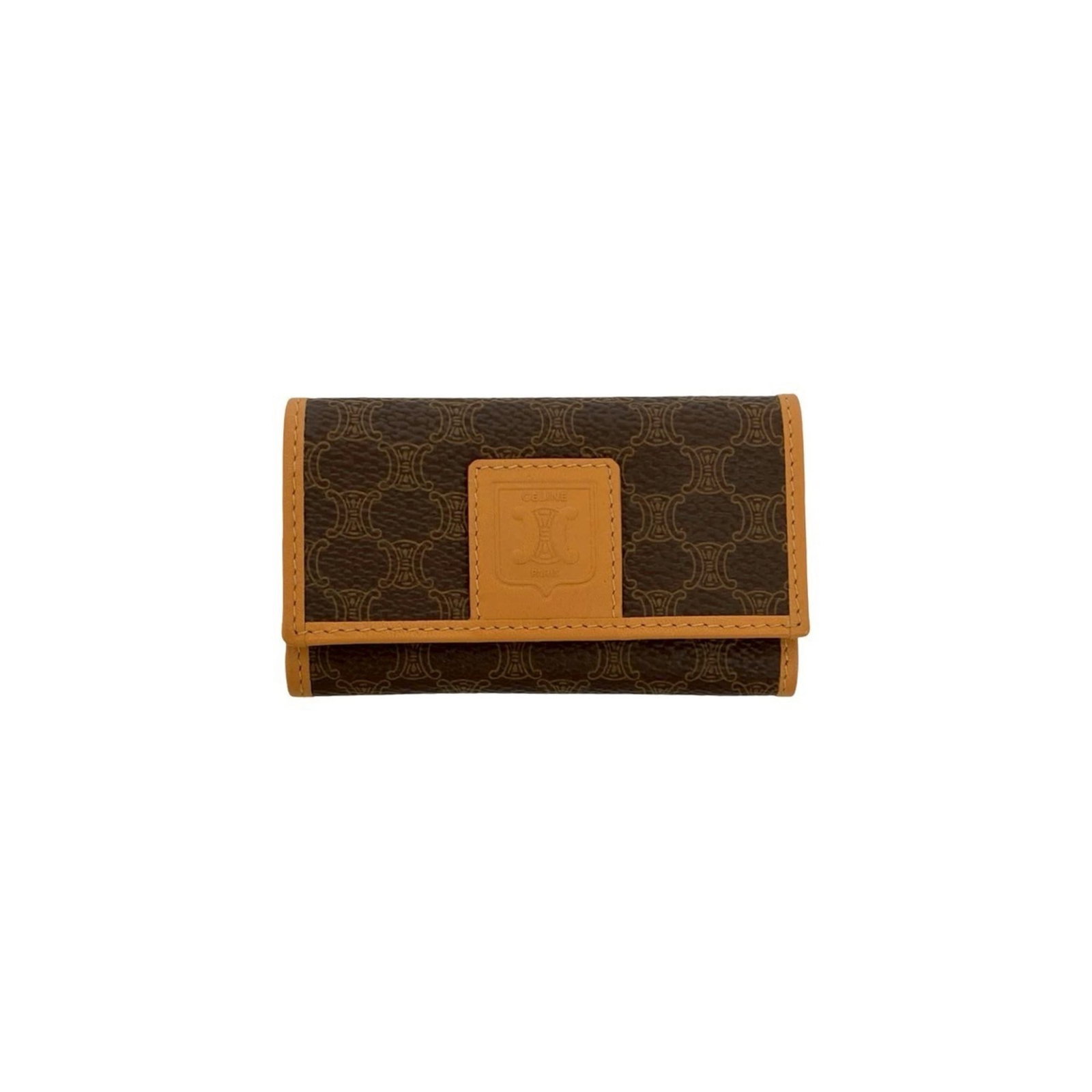 Celine Keycase Leather Pvc: Celine Keycase Leather Pvc Used like new, the Celine Keycase Leather Pvc boasts a rich brown color and premium materials. This stylish keycase features a durable blend of leather and PVC, making it a 