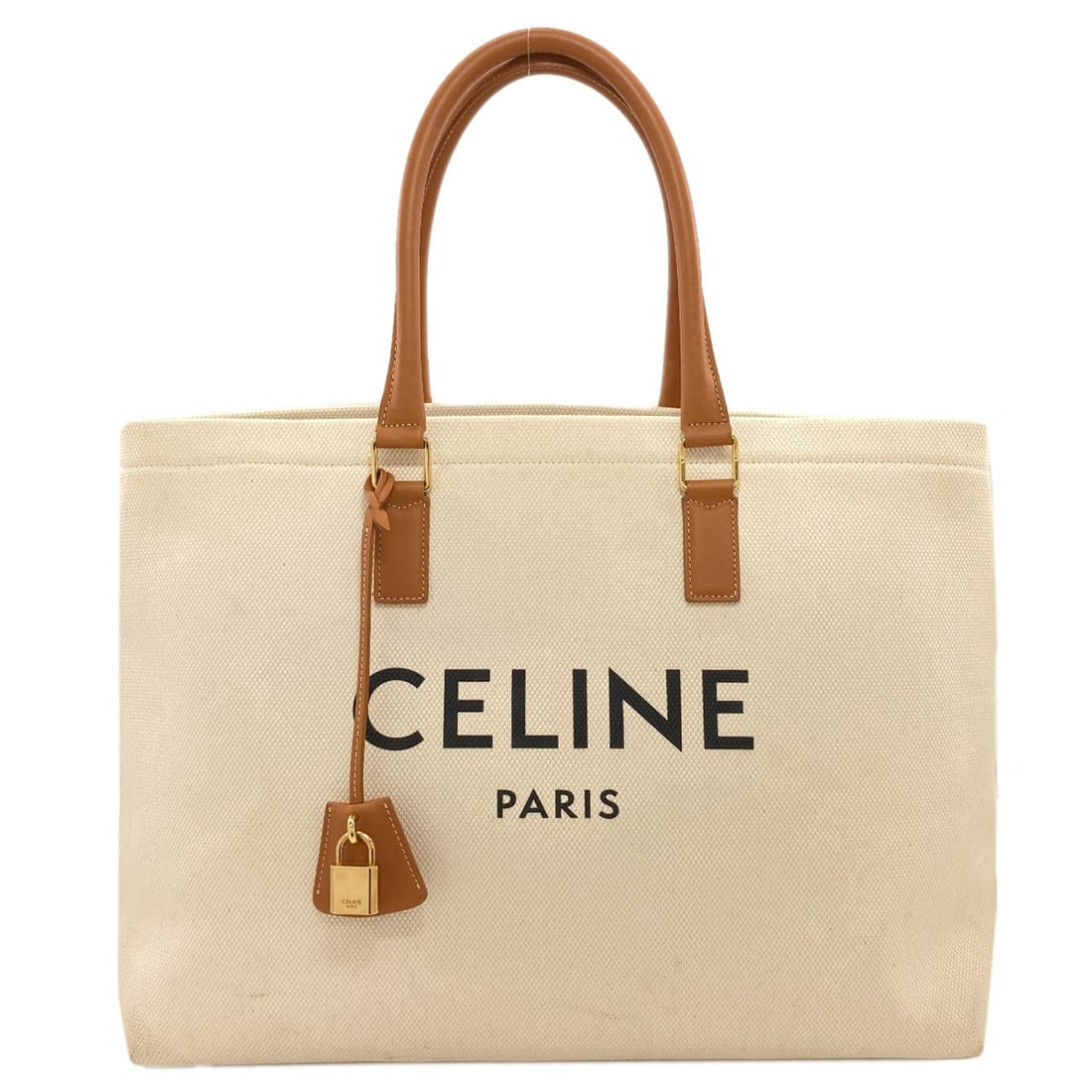 Canvas Celine Tote Bag Horizontal Cabas: Canvas Celine Tote Bag Horizontal Cabas White canvas tote bag with a horizontal cabas design, characteristic of the CELINE brand. This classic style features a clean and minimalist aesthetic,