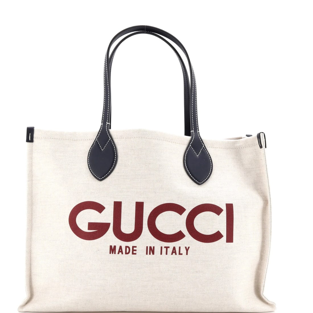 Gucci Logo Shopper Tote Printed Canvas Medium: Gucci Logo Shopper Tote Printed Canvas Medium Canvas Medium Gucci Logo Shopper Tote with Neutral Exterior and Blue Interior, featuring the iconic Gucci logo print. This medium-sized tote boasts a