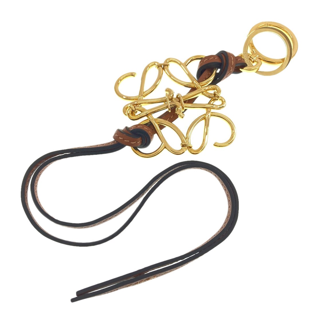 Loewe Anagram Key Ring Metal Leather: Loewe Anagram Key Ring Metal Leather Gold metal and leather key ring from LOEWE, featuring an elegant design. This stylish accessory showcases the brand's signature style with its gold finish and
