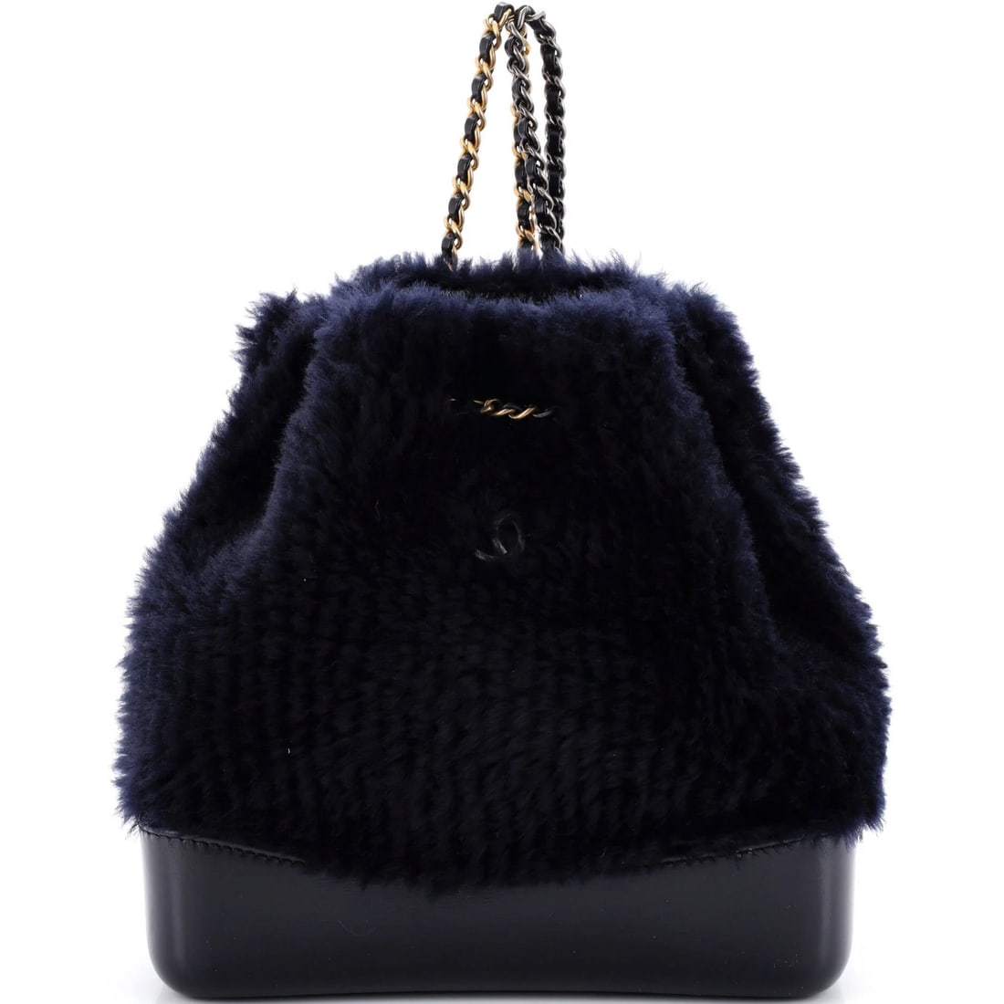 Shearling and Leather Small Backpack by Chanel Gabrielle: Shearling and Leather Small Backpack by Chanel Gabrielle Small and stylish, the Chanel Gabrielle Shearling and Leather Backpack features a sleek blue exterior with gold tone hardware. Measuring just