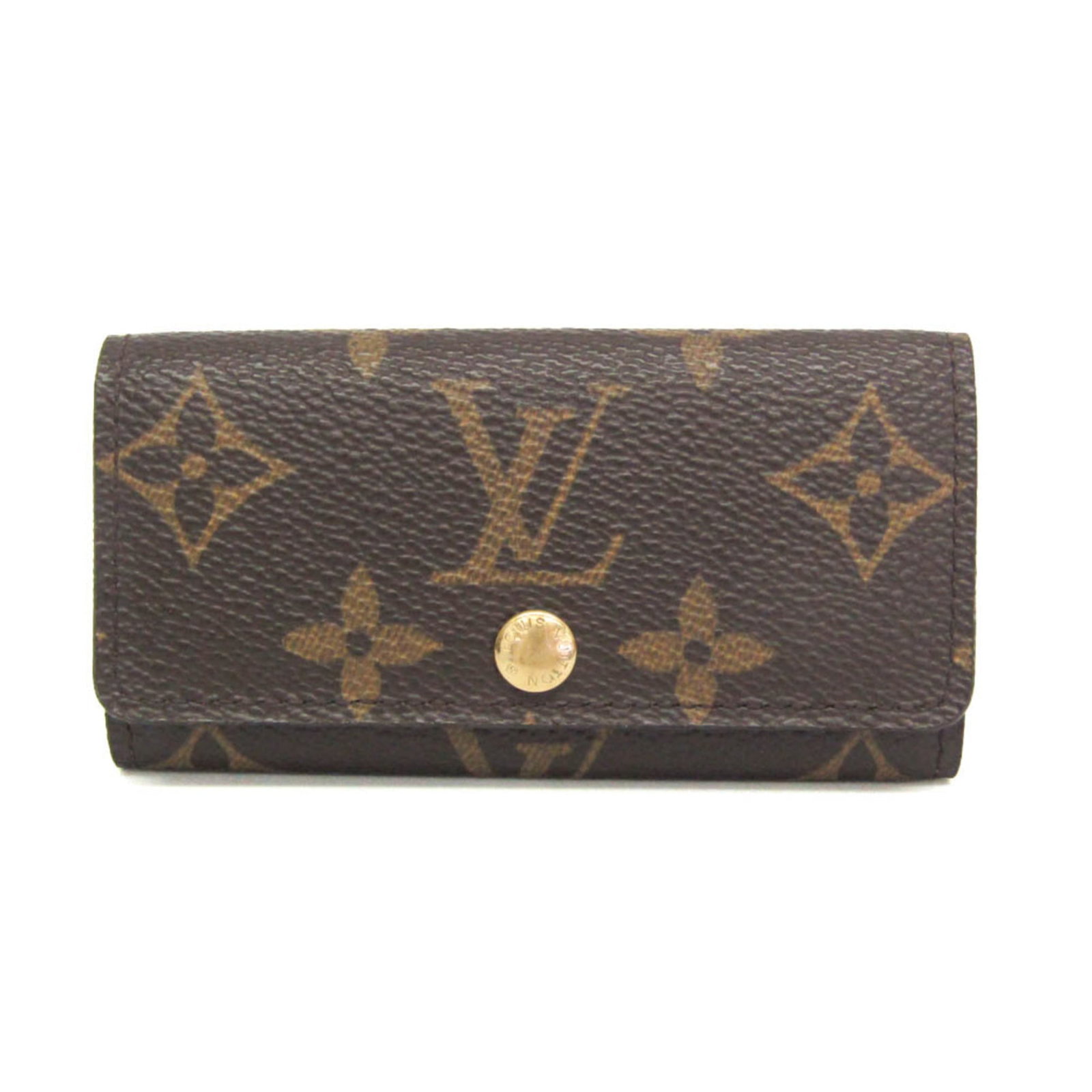 Keycase of Monogram Louis Vuitton: Keycase of Monogram Louis Vuitton Brown Monogram Louis Vuitton Keycase with Snap Closure, featuring the iconic monogram pattern and four key hooks for secure storage. This used keycase showcases a