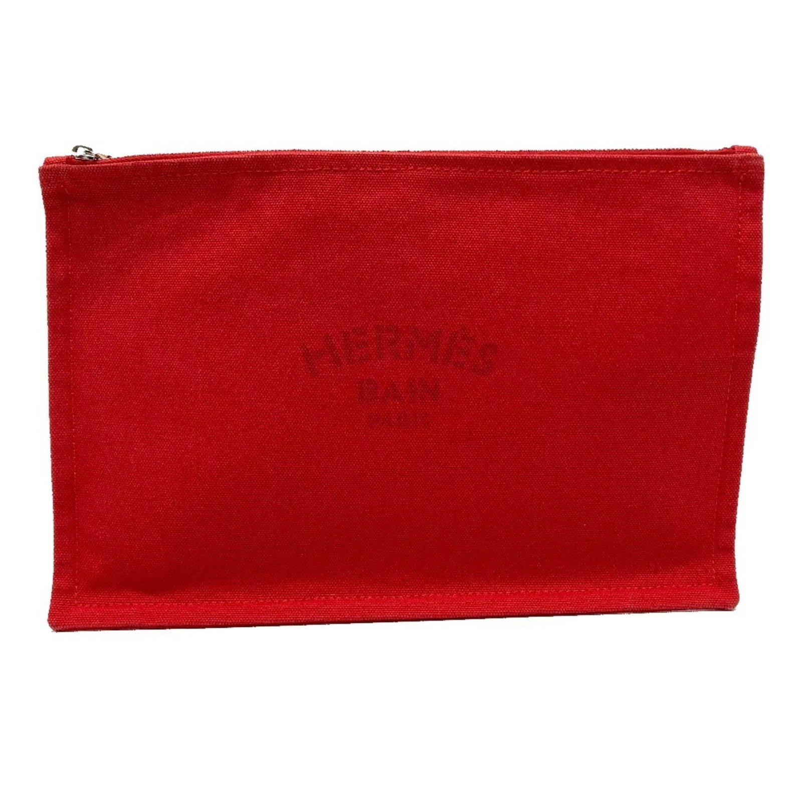 Pouch Cotton from Hermes: Pouch Cotton from Hermes Soft and vibrant red, this Herm?s pouch cotton features a classic design with a sturdy zipper closure. Made from high-quality cotton, the pouch measures approximately 18cm x 2