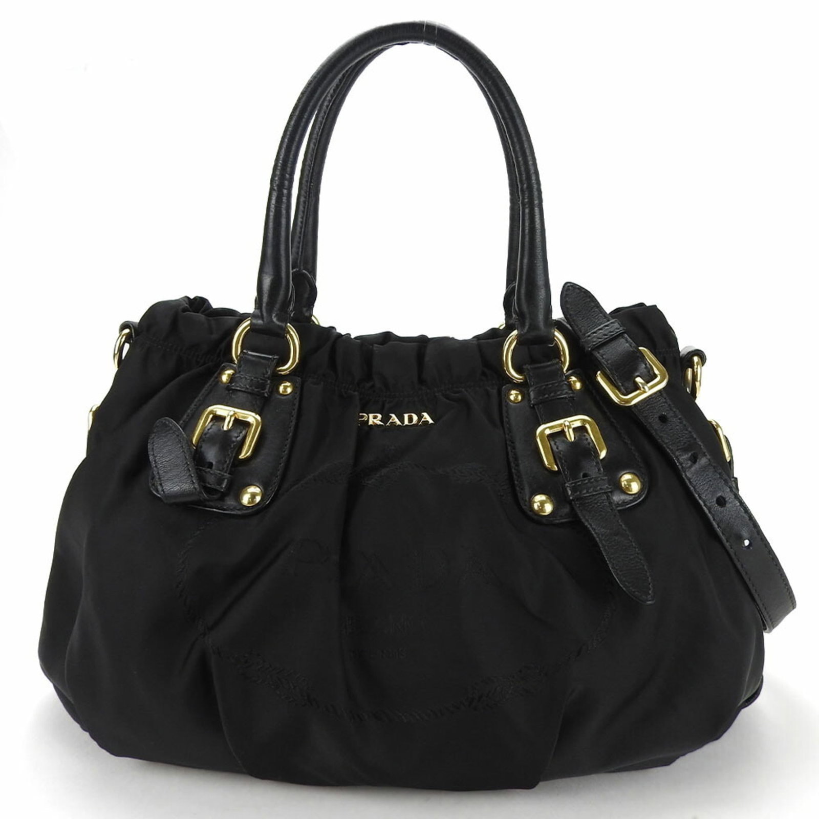 Handbag Nylon Leather by Prada: Handbag Nylon Leather by Prada Prada's Handbag Nylon Leather boasts a sleek, casual design with a striking black color. Made from high-quality materials, the bag features both nylon and leather compon