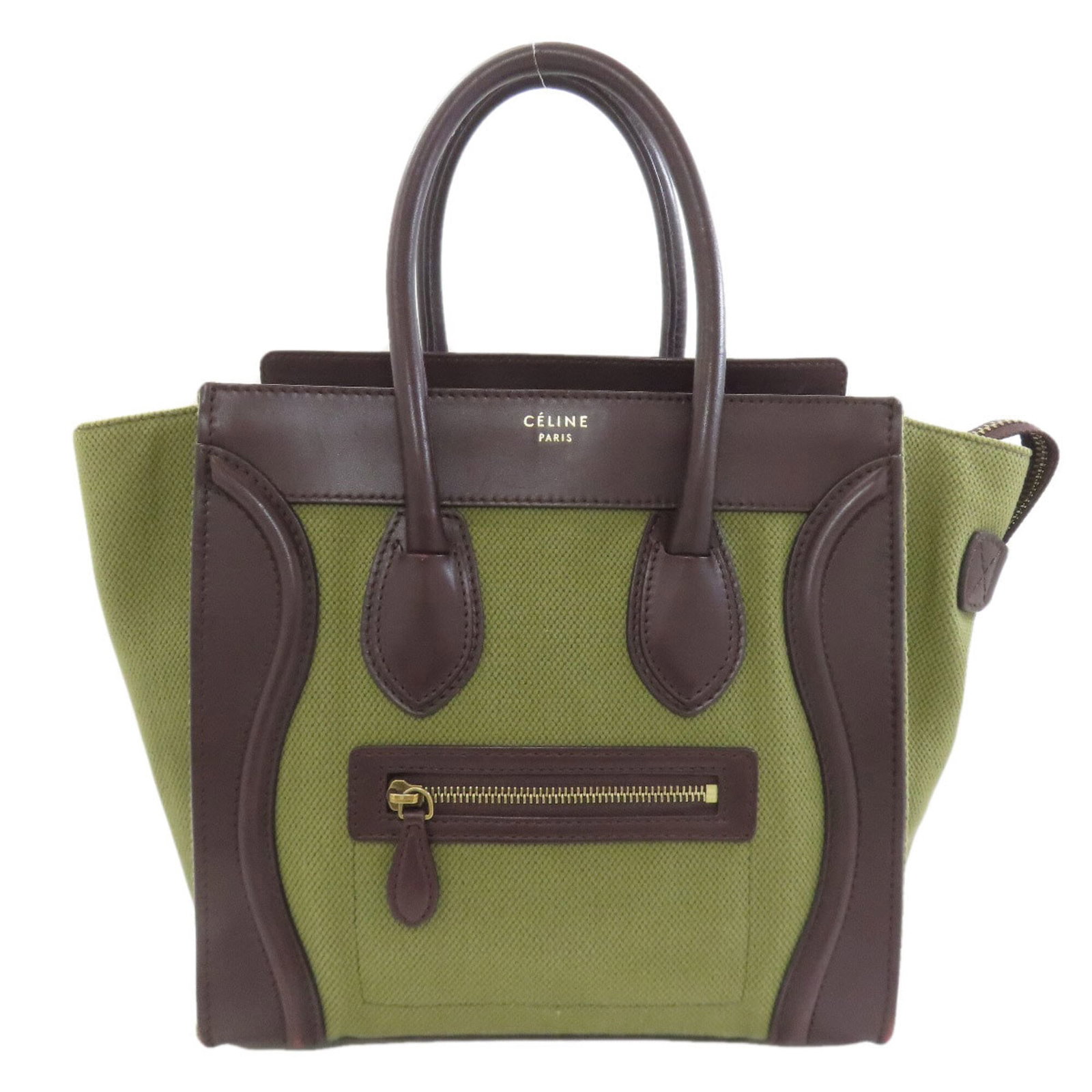 Celine Handbag Canvas Leather: Celine Handbag Canvas Leather Canvas and leather come together in this Celine handbag, offering a unique blend of textures and styles. The brown color with khaki accents adds a touch of versatility