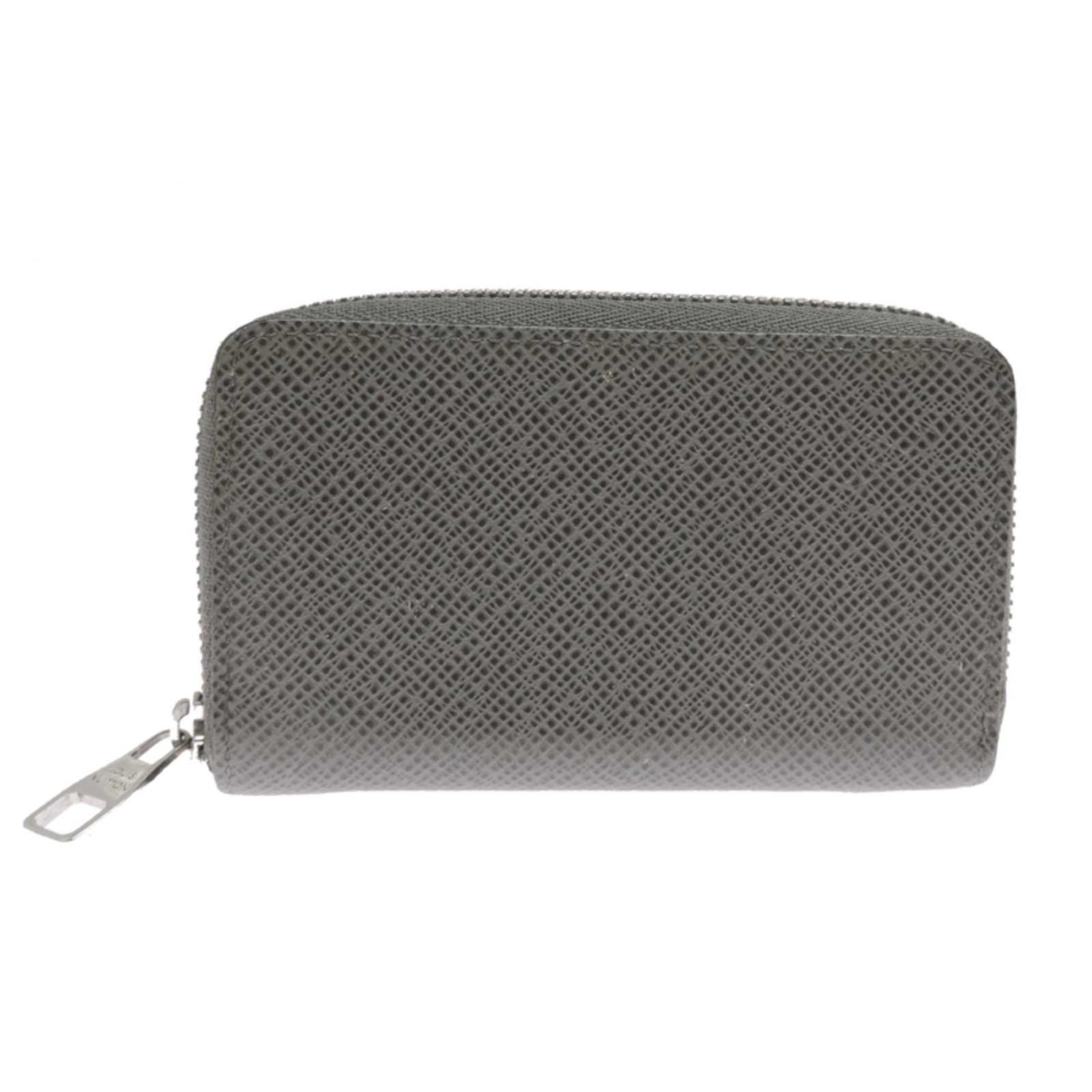 Louis Vuitton Coin Purse/ Coin Case Taiga Leather: Louis Vuitton Coin Purse/ Coin Case Taiga Leather Taiga Leather Louis Vuitton Coin Purse in Gray, with visible traces of usage and minor scratches. This used coin case measures 7cm x 11.5cm x 2cm and