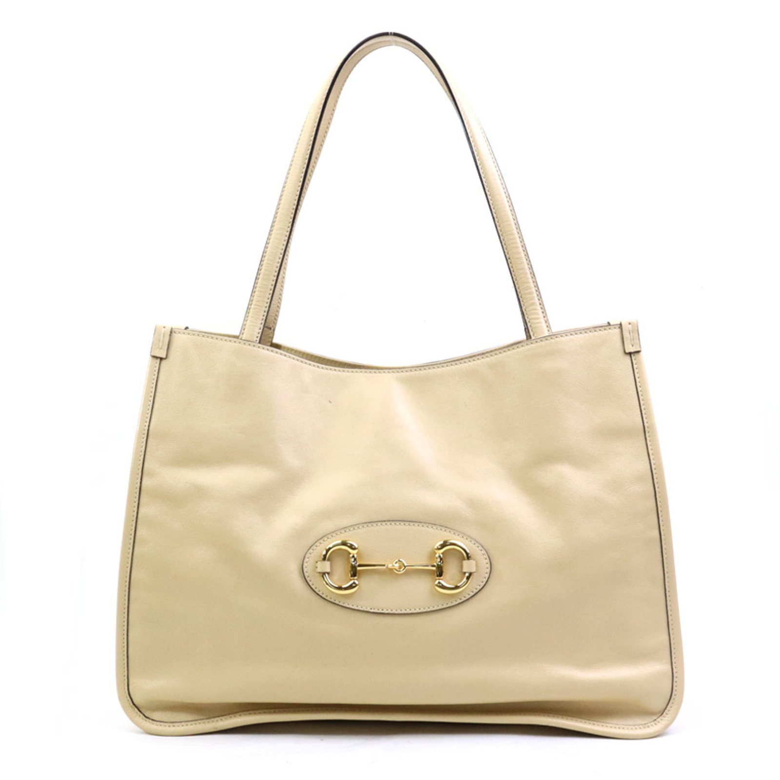 Shoulder Bag Leather Gucci: Shoulder Bag Leather Gucci This Gucci shoulder bag features high-quality leather in a classic beige color. With its spacious interior and sturdy design, it's perfect for everyday use. The bag shows si