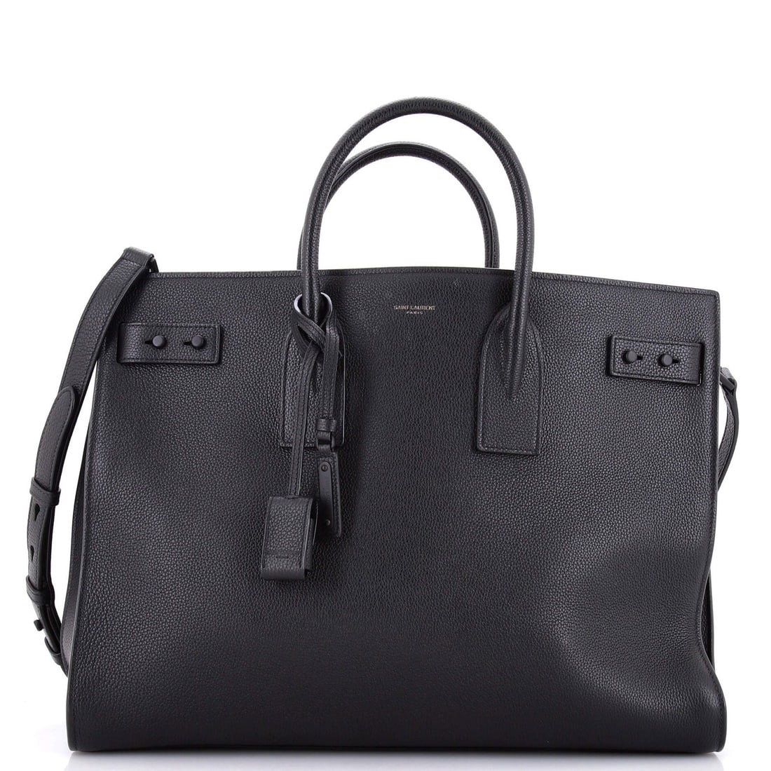 Sac de jour souple large leather bag Saint Laurent: Sac de jour souple large leather bag Saint Laurent Large Saint Laurent Sac de Jour Souple Leather Bag in Black, featuring top handle and adjustable strap. Minor creases and scuffs on exterior, while