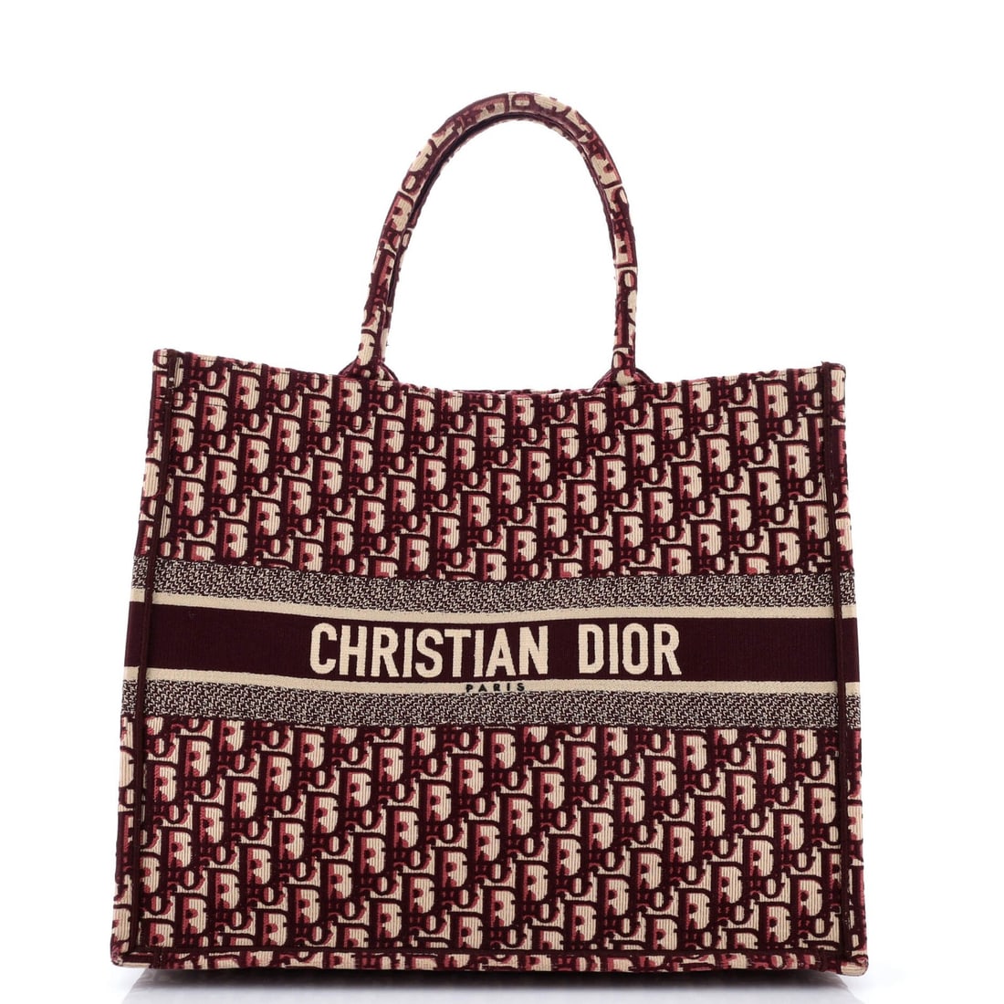 Oblique canvas book Christian Dior Large tote: Oblique canvas book Christian Dior Large tote Red Oblique Canvas Large Tote by Christian Dior, featuring a striking canvas exterior with minor scuffs and creases. This large tote measures 13.5" tall