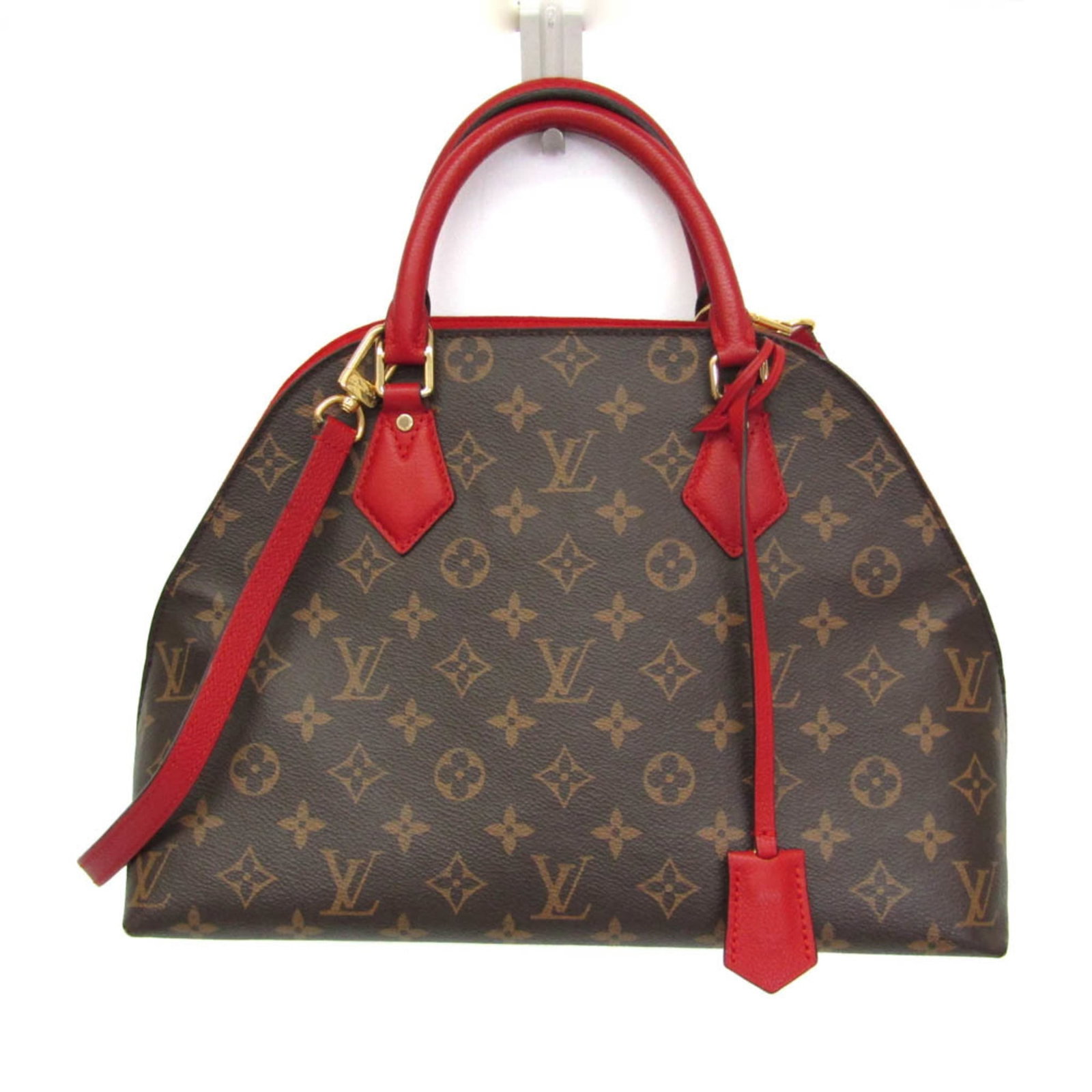 Handbag Monogram Leather Vuitton Louis Shoulder: Handbag Monogram Leather Vuitton Louis Shoulder Monogrammed leather shoulder bag from Louis Vuitton, featuring the iconic monogram pattern and red accents. This pre-owned handbag boasts a classic desi