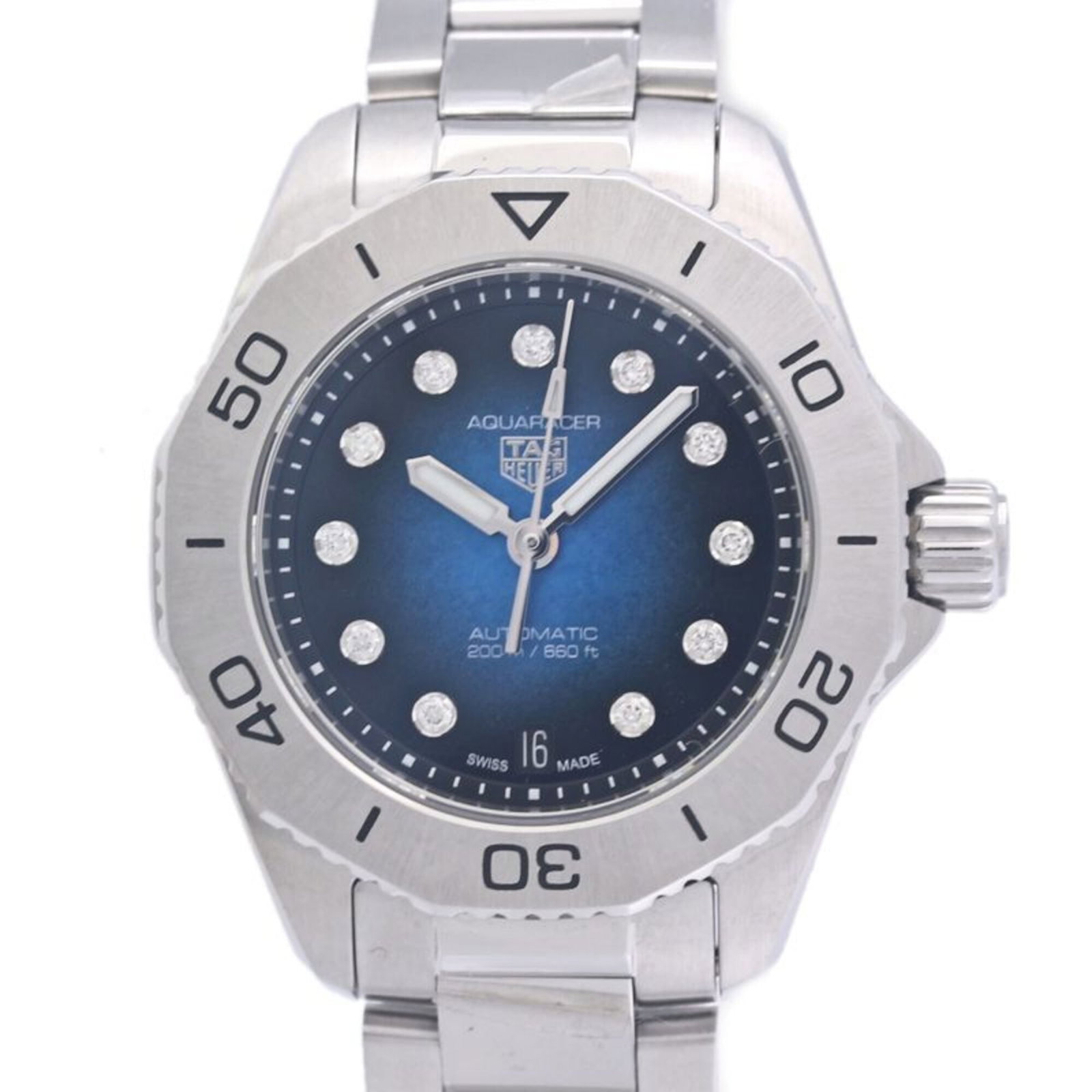 Wristwatch by Heuer: Wristwatch by Heuer Stainless steel case and band provide a sleek, modern look for the woman on-the-go. This blue gradient dial wristwatch boasts a 30mm diameter case that fits wrists up to 19.5cm in 