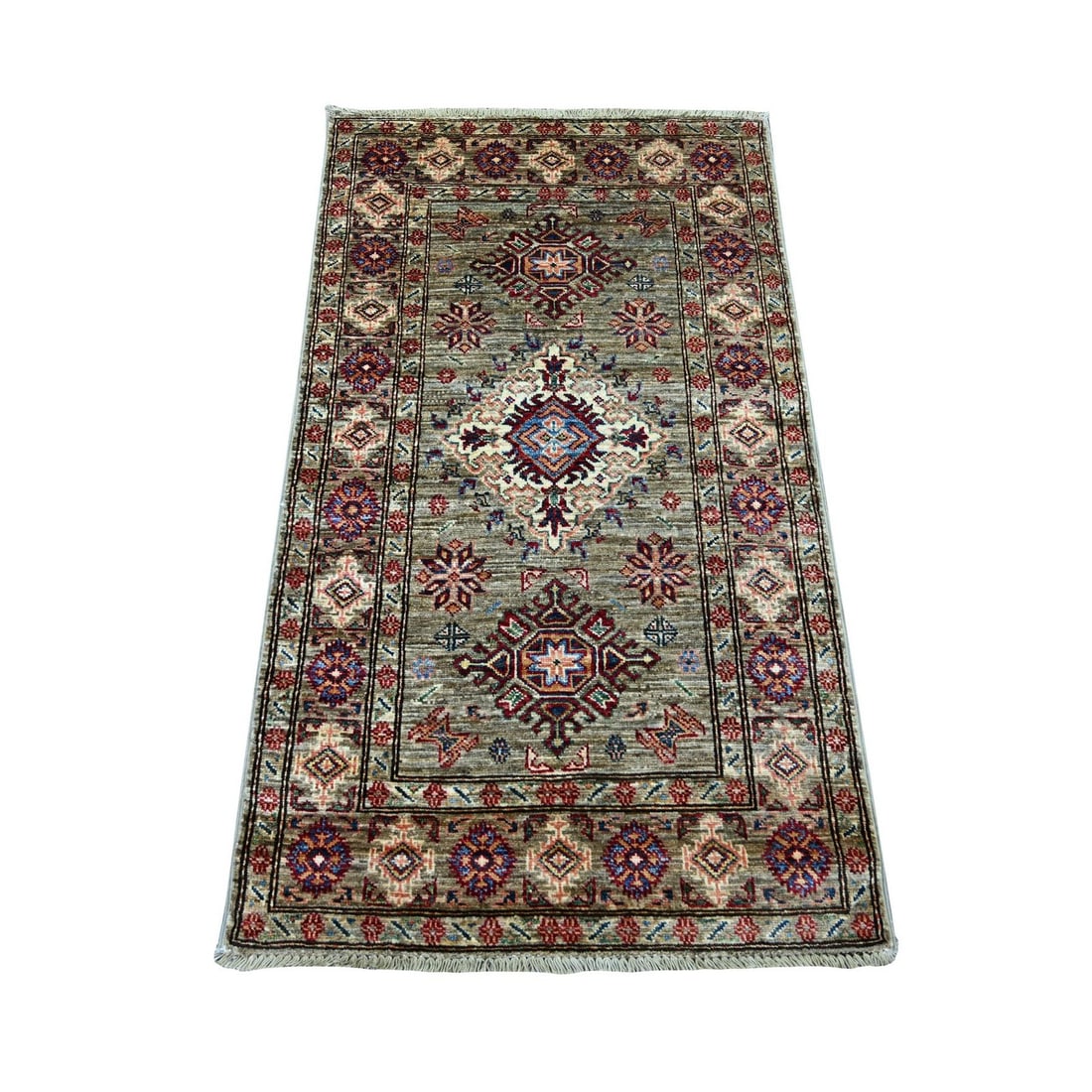 2'7"x4'6" Green Afghan Super Kazak Medallions Design Hand Knotted Wool Rug: 2'7"x4'6" Green Afghan Super Kazak Medallions Design Hand Knotted Wool Rug Hand-knotted in wool, this vibrant green Kazak-style rug boasts an all-over design featuring intricate patterns. Measuring