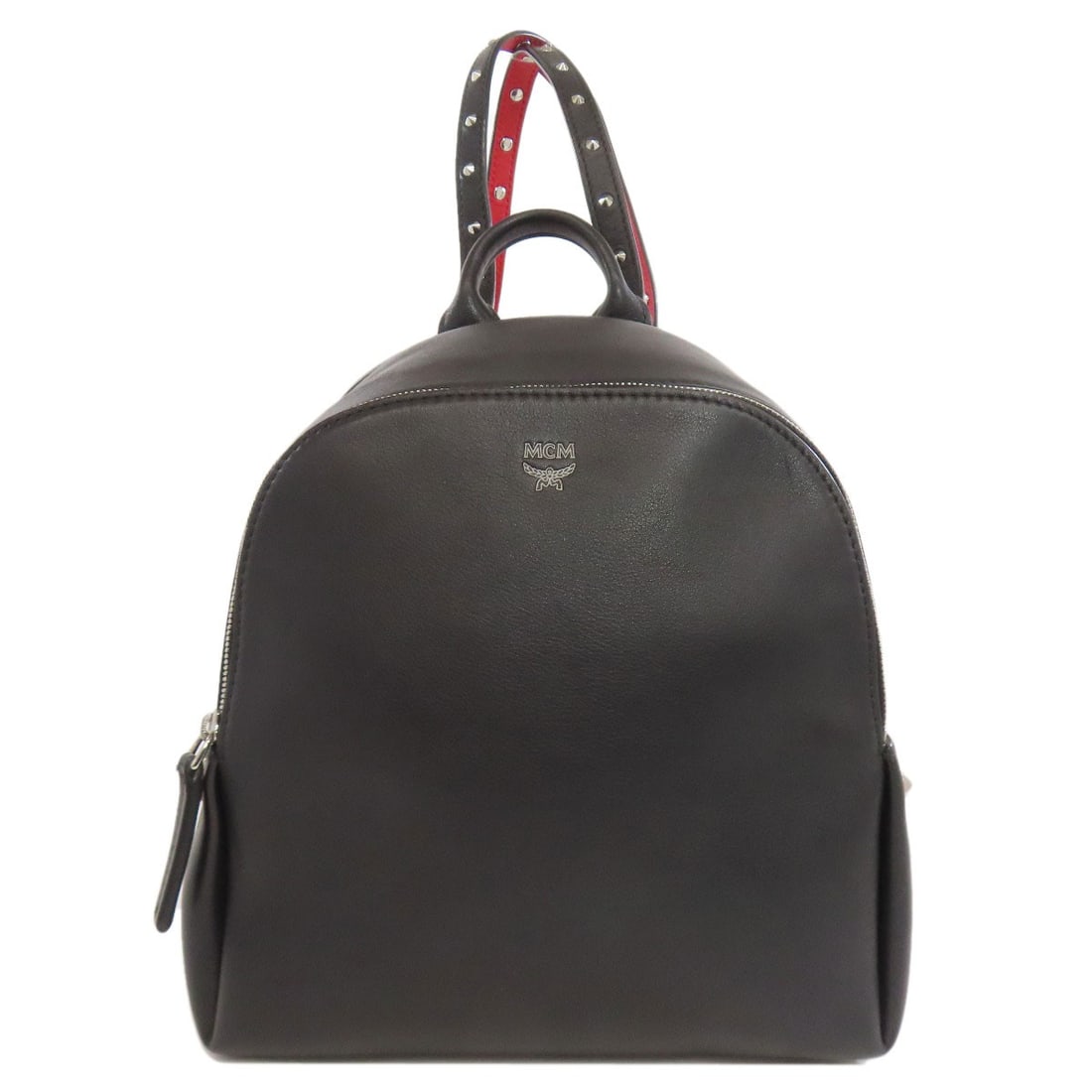 Mcm Leather Backpack Daypack: Mcm Leather Backpack Daypack Black leather backpack with MCM branding, featuring a classic daypack design. Made from high-quality leather exterior and [insert material if provided], this A* style