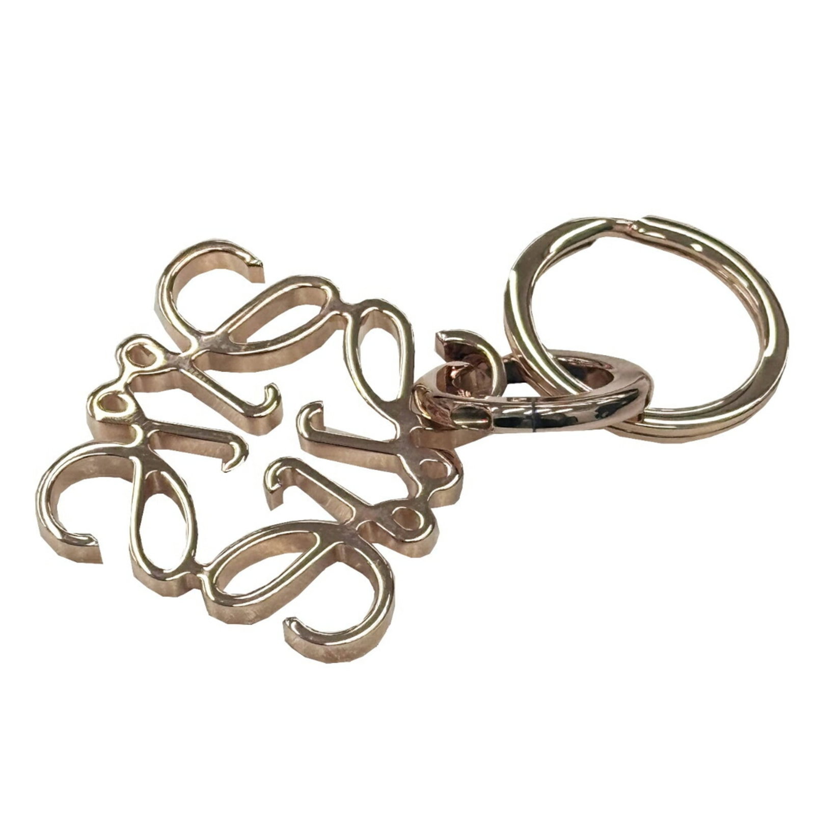 Loewe Keyring Brass: Loewe Keyring Brass This vintage Loewe keyring in rose gold brass boasts a classic design with subtle scratches and wear, adding to its unique character. Made from high-quality brass, the keyring meas