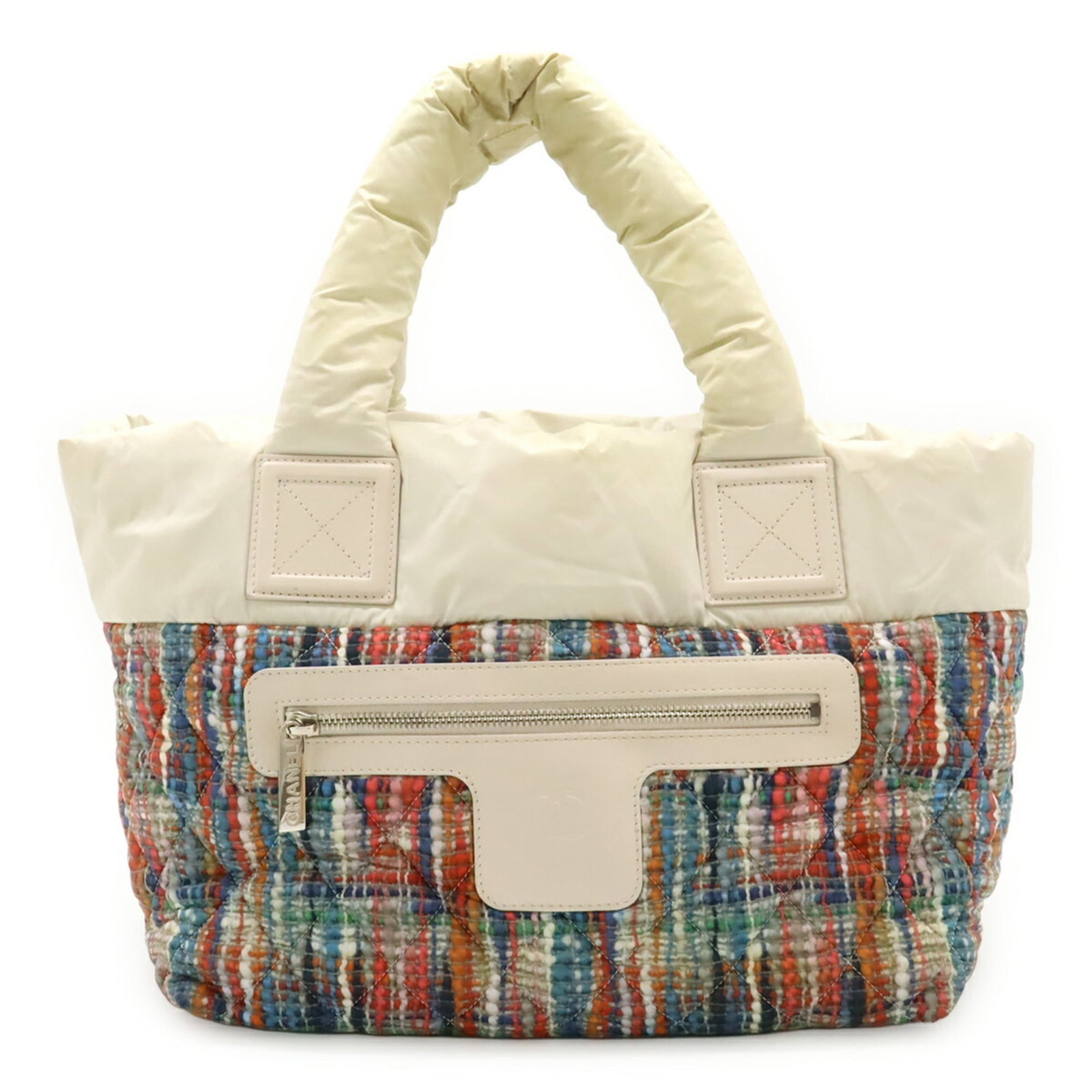 Handbag Nylon Leather Tote Chanel: Handbag Nylon Leather Tote Chanel Nylon and leather blend gives this Chanel tote its unique look, featuring multi-colors including orange and white. The bag measures 24.5cm x 28.5cm x 16cm and shows t