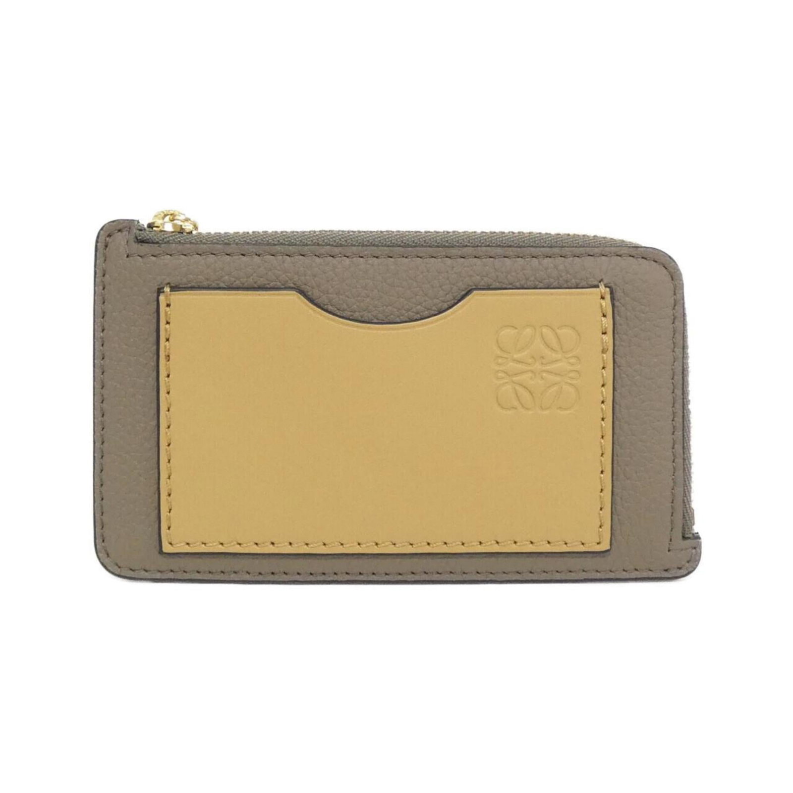 Loewe Coin Purse/ Coin Case Leather: Loewe Coin Purse/ Coin Case Leather This vintage Loewe coin purse features rich, supple calfskin leather and bears the signature of its creator. With its classic design and timeless elegance, it's a