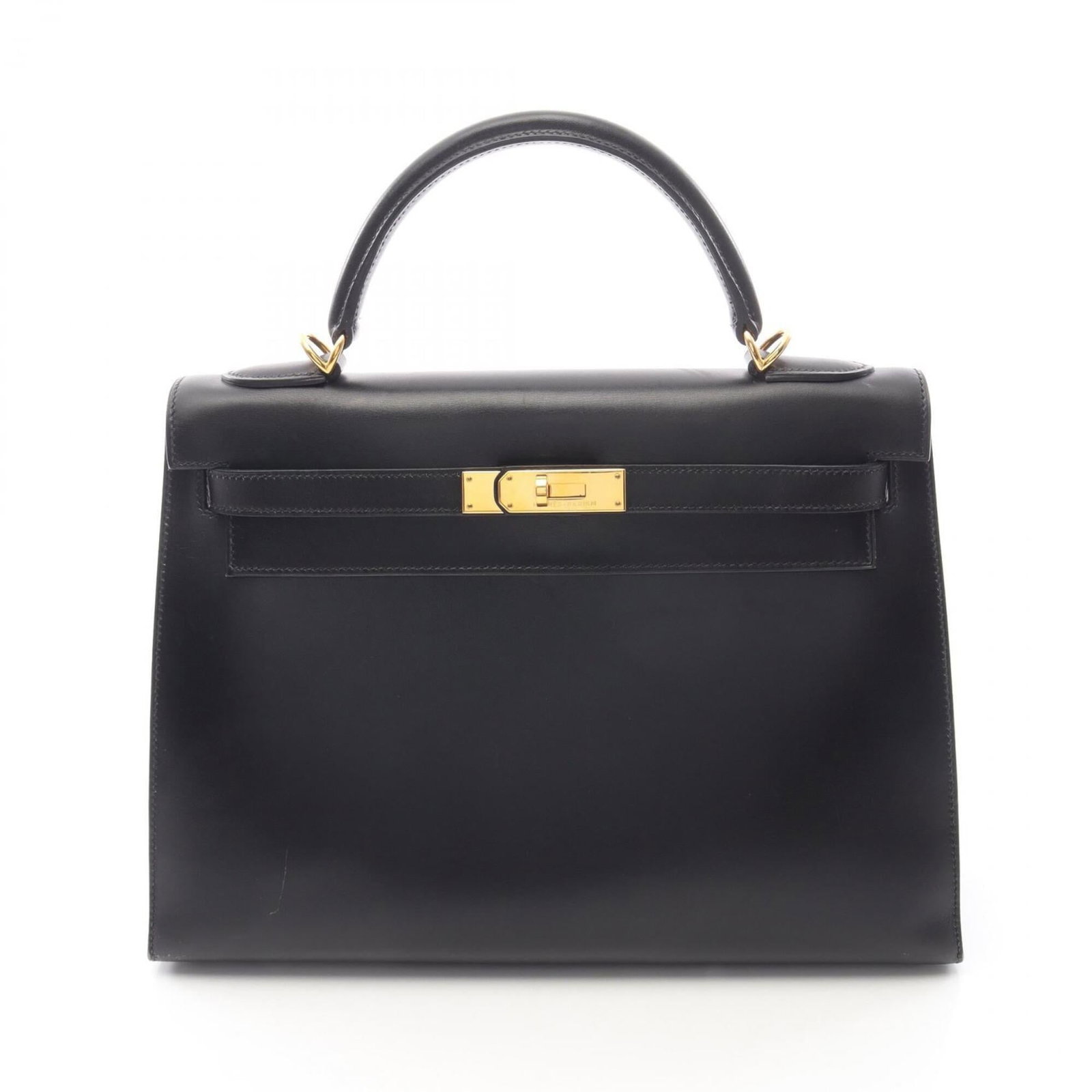 Calf leather handbag Hermes box: Calf leather handbag Hermes box Box Calf Leather Handbag in Black. This used Hermes handbag features box calf leather and measures 23cm x 32cm x 12cm, with a few traces of usage visible but overall in