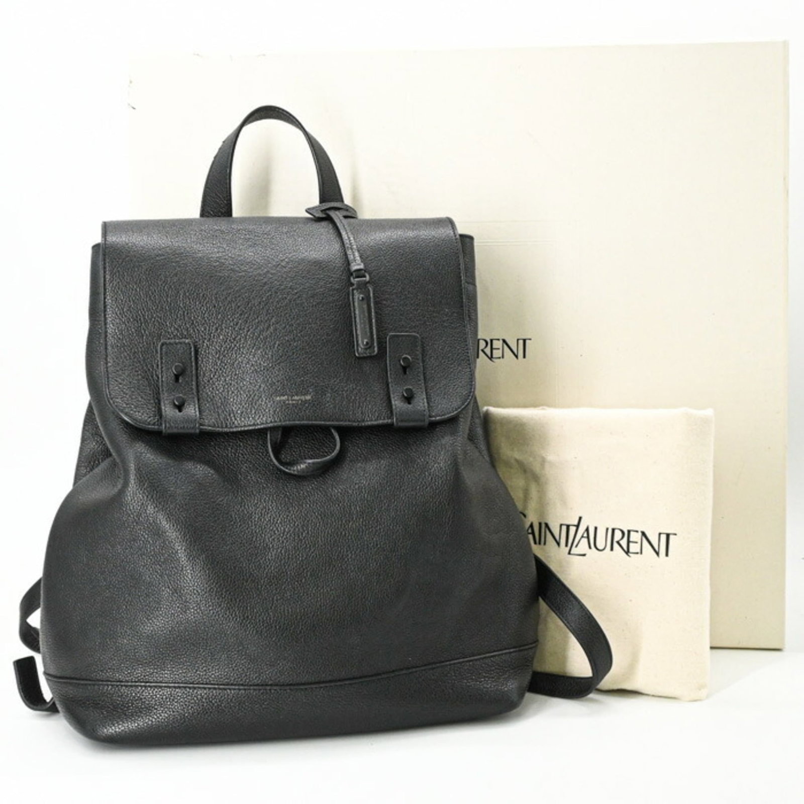 Saint Laurent Yves Backpack: Saint Laurent Yves Backpack Black Saint Laurent Yves Backpack, featuring a classic design with a few traces of usage visible. The backpack has some scratches and dirt but remains in very good
